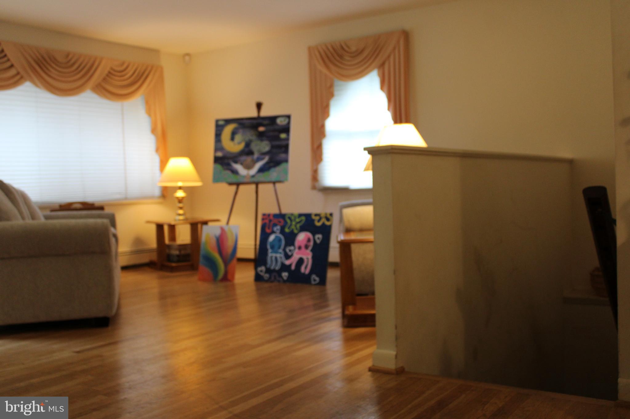 6036 Chesworth Road Baltimore, MD 21228 - Photo 13 of 15 a view of a livingroom with furniture and a window