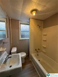 a bathroom with a sink and a bathtub