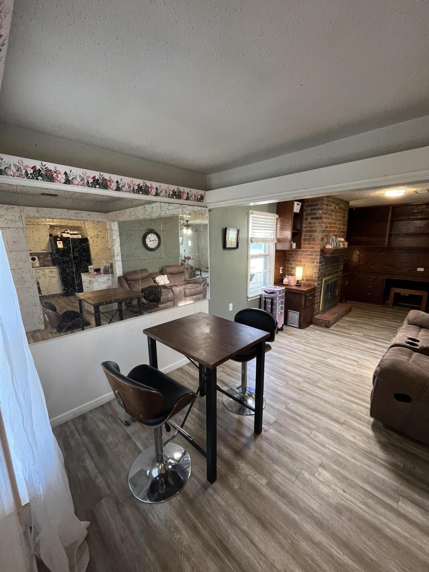 4907 38th Street Lubbock, TX 79414 - Photo 2 of 6 a living room with furniture and a table