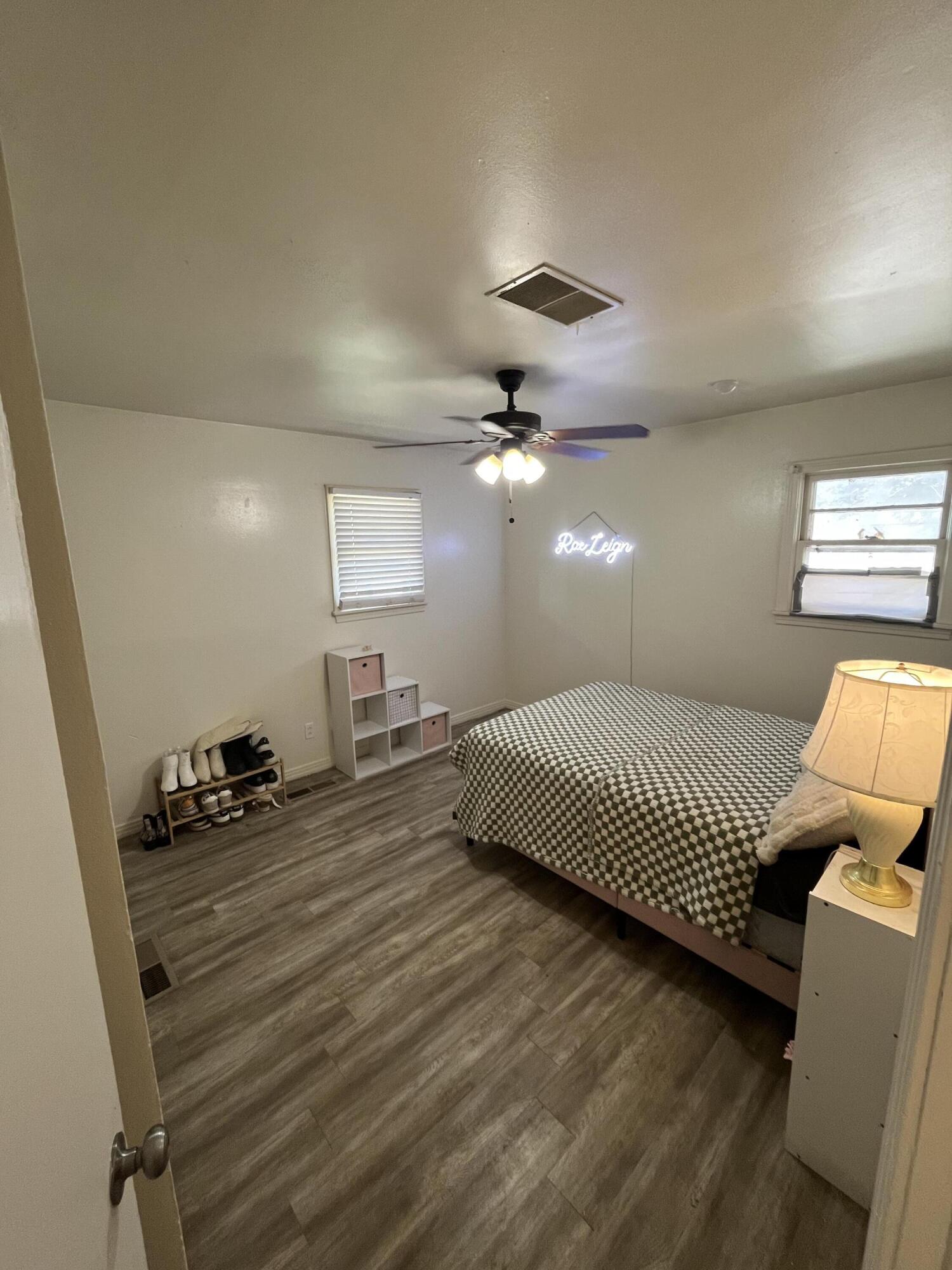 4907 38th Street Lubbock, TX 79414 - Photo 6 of 6 a bedroom with a bed and ceiling fan
