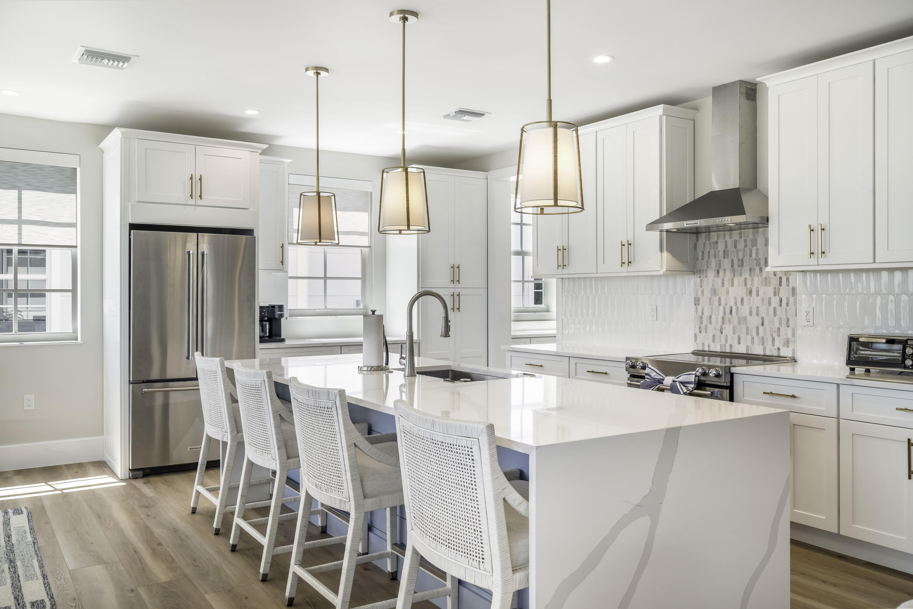 815 39th Street Marathon, FL 33050 - Photo 13 of 24 a kitchen with stainless steel appliances granite countertop a refrigerator a sink dishwasher a stove a kitchen island with a dining table and chairs