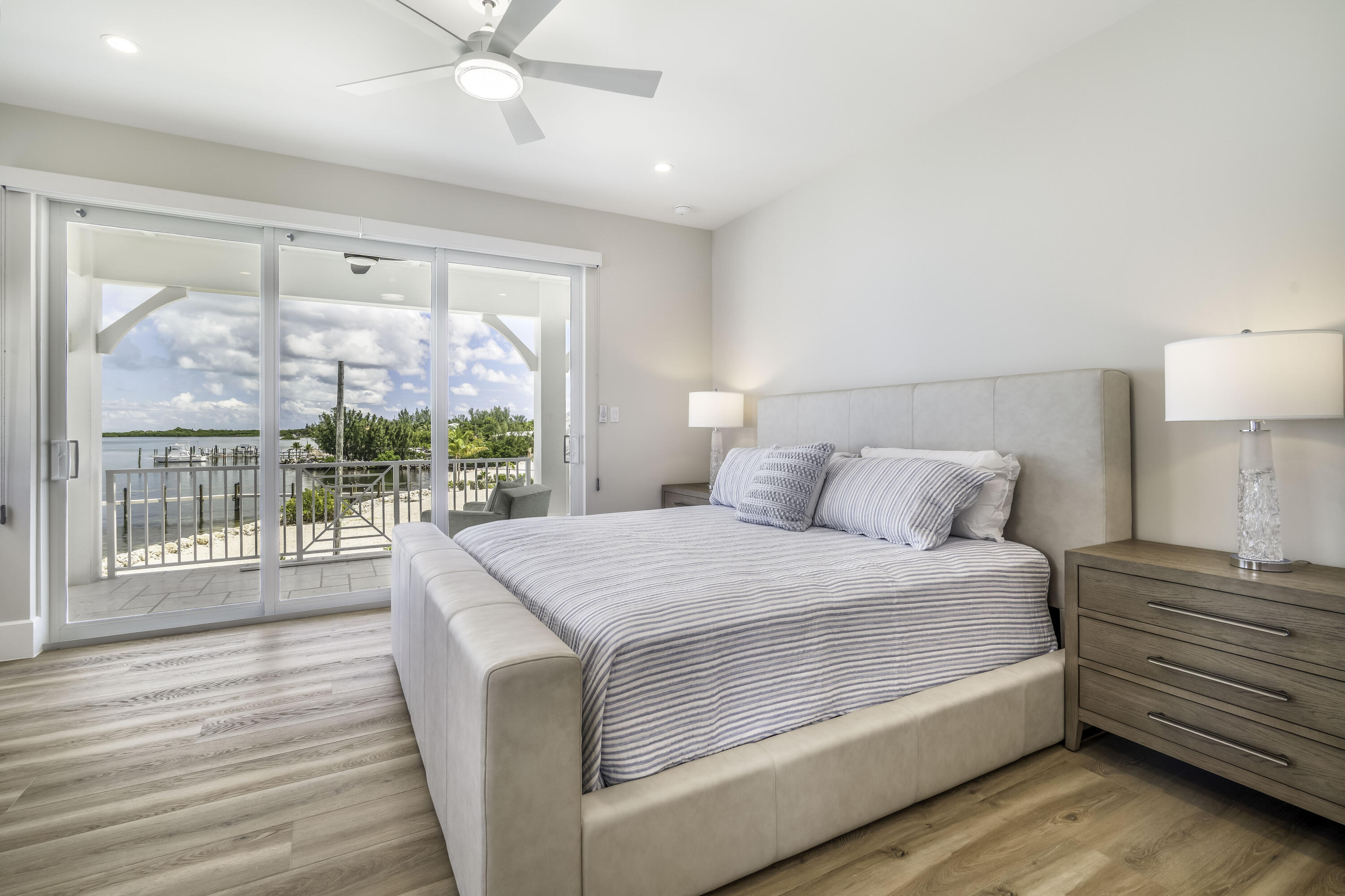 815 39th Street Marathon, FL 33050 - Photo 17 of 24 a bedroom with a large bed and a large window with outer view