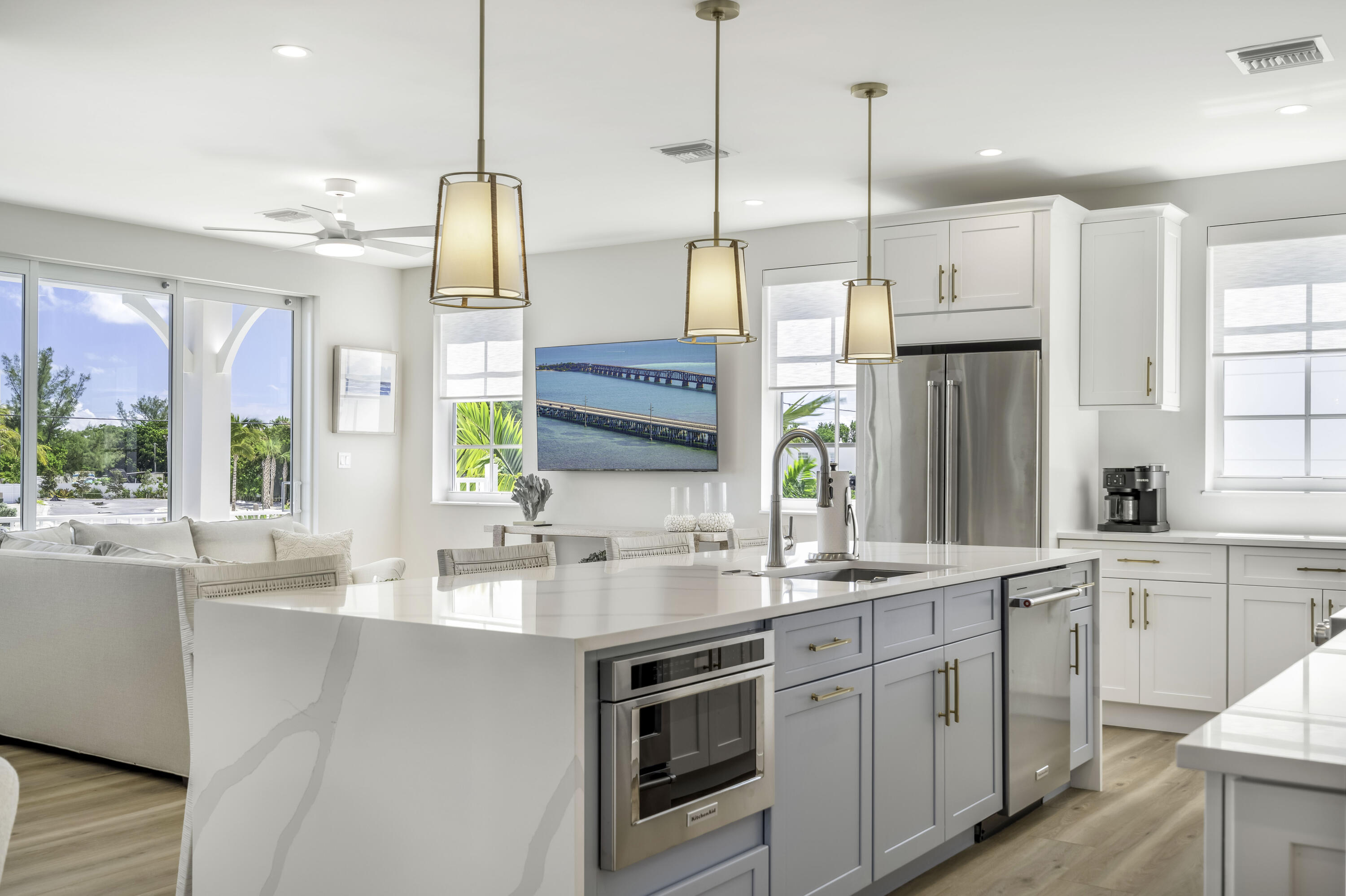 815 39th Street Marathon, FL 33050 - Photo 9 of 24 a kitchen with stainless steel appliances a sink a stove a refrigerator a center island and windows