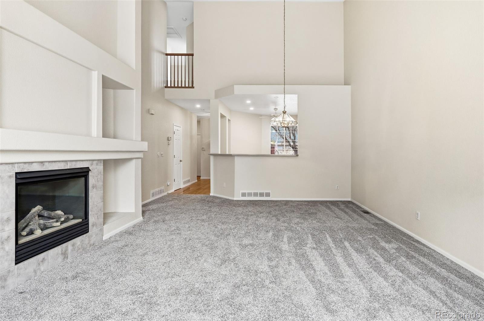 2526 South Tucson Circle Aurora, CO 80014 - Photo 11 of 33 a view of a livingroom with a fireplace and window