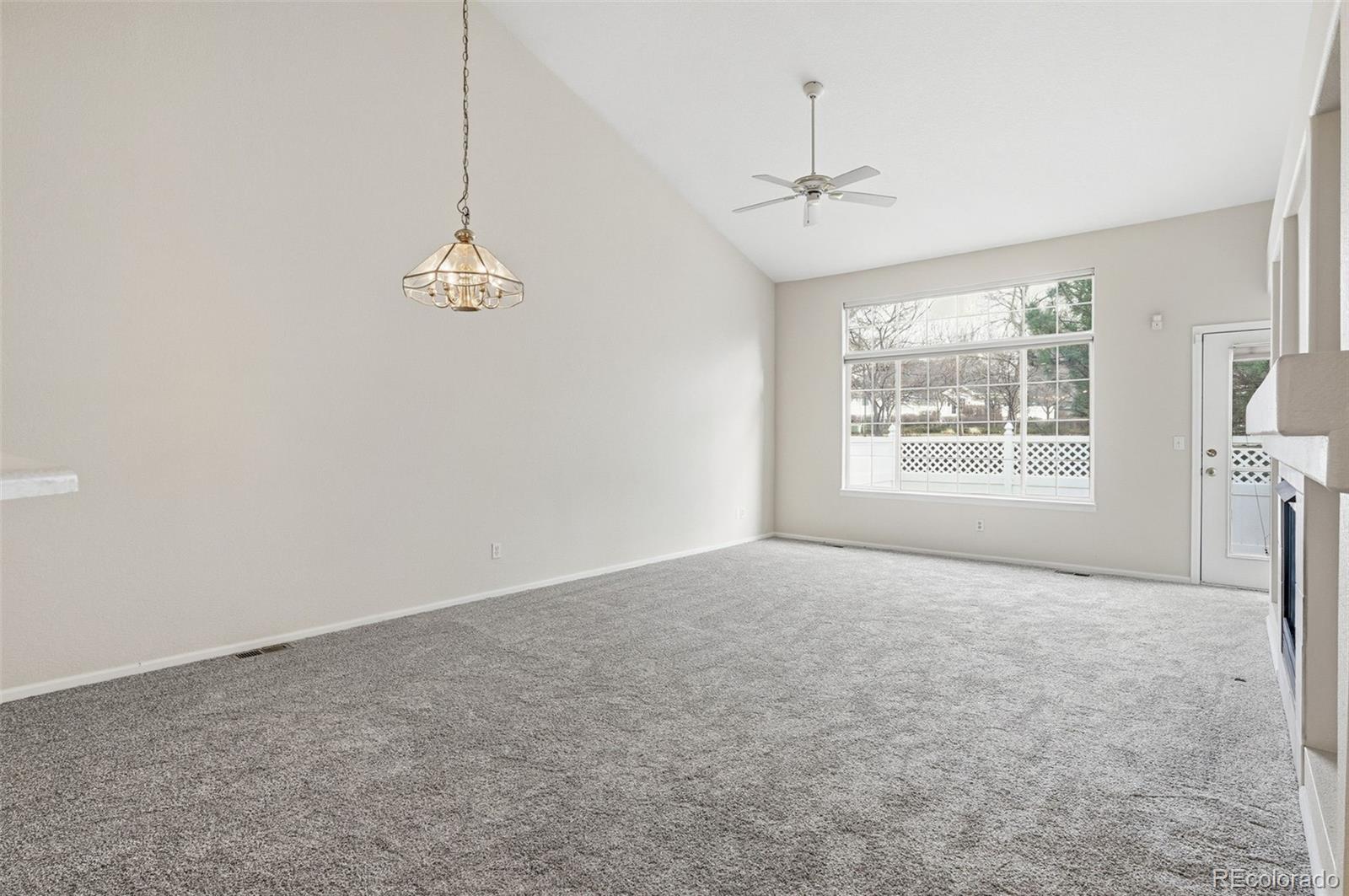 2526 South Tucson Circle Aurora, CO 80014 - Photo 13 of 33 an empty room with windows and ceiling fan