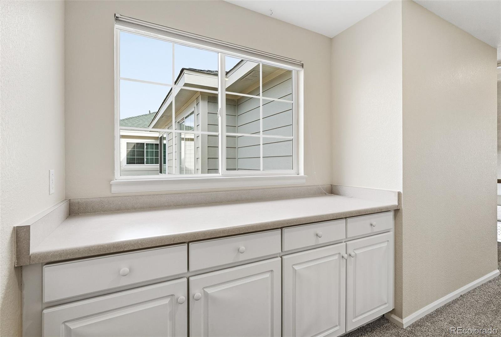 2526 South Tucson Circle Aurora, CO 80014 - Photo 18 of 33 a kitchen with a sink and cabinets