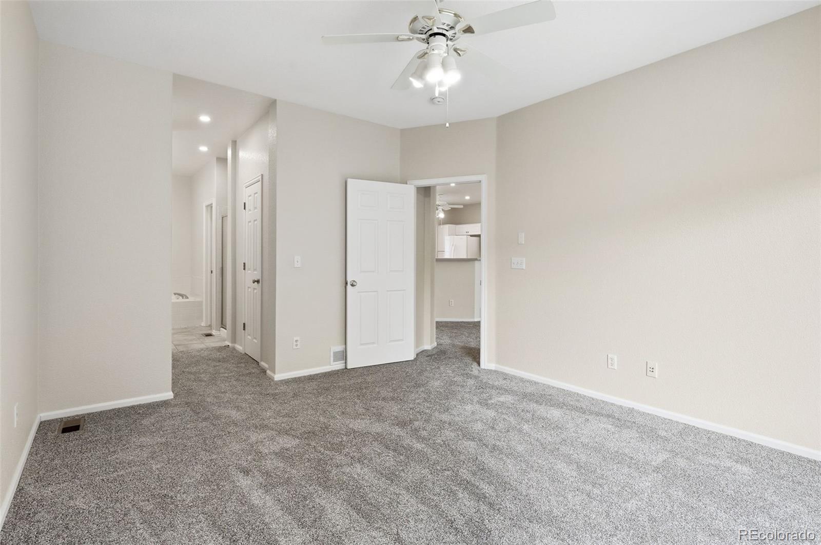 2526 South Tucson Circle Aurora, CO 80014 - Photo 22 of 33 an empty room with fan and entrance