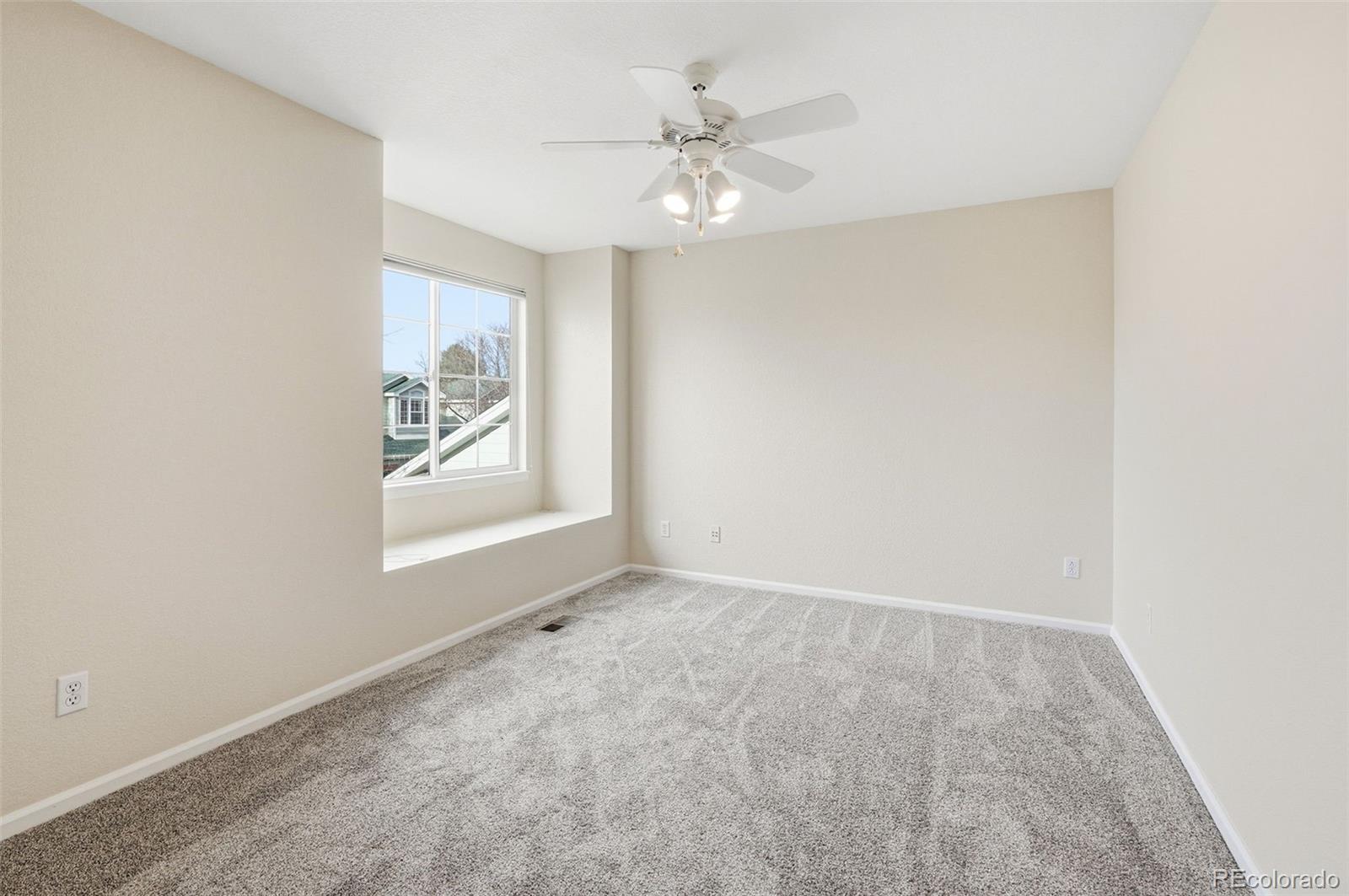 2526 South Tucson Circle Aurora, CO 80014 - Photo 25 of 33 an empty room with windows and fan