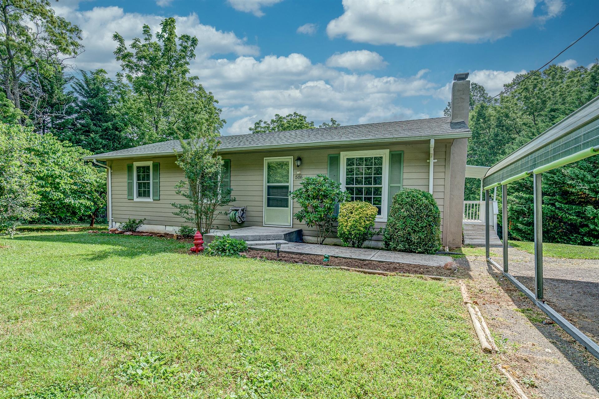 516 Jefferson Dock Road Penhook, VA 24137 - Photo 2 of 20 front view of a house with a yard
