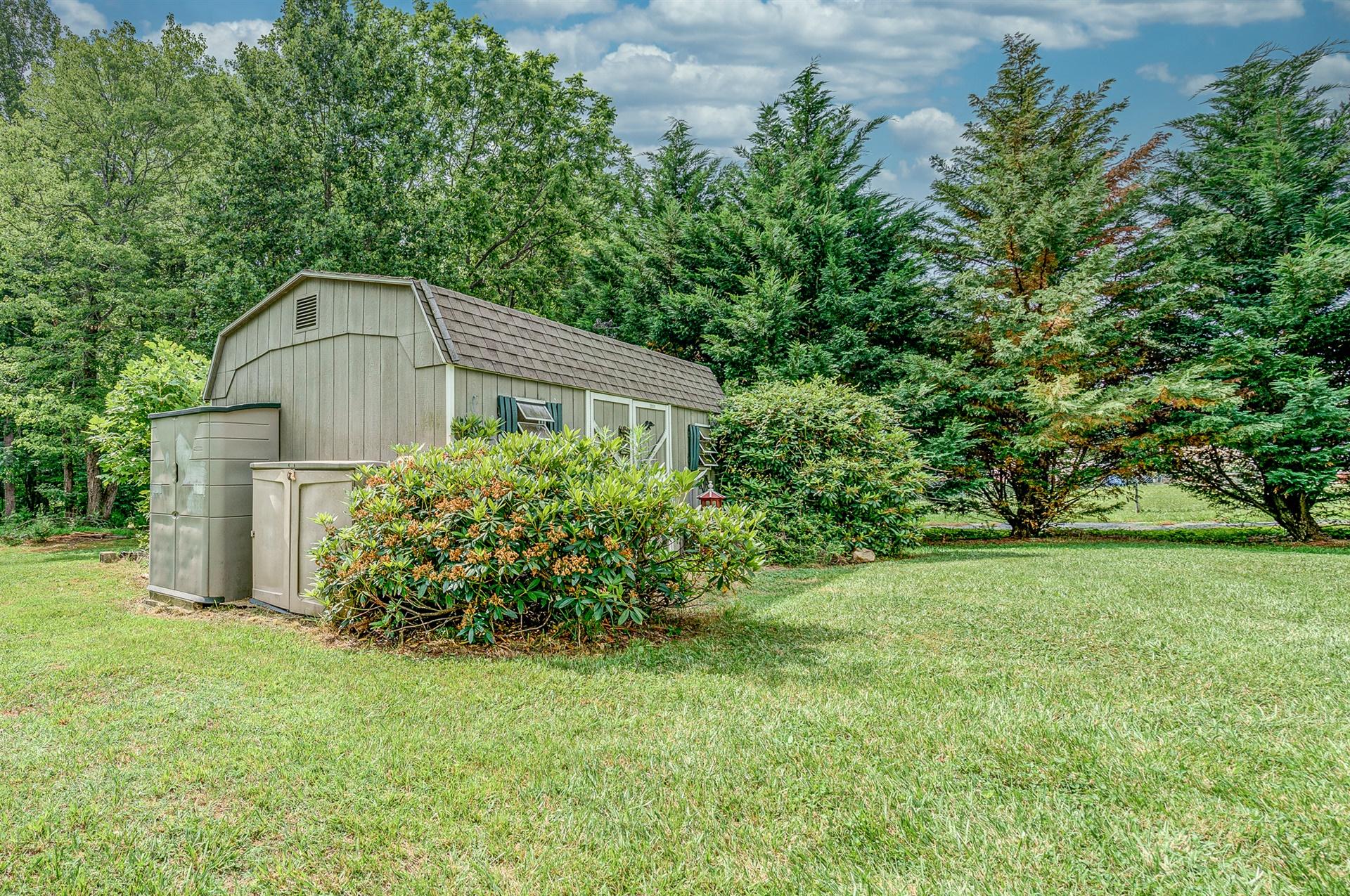 516 Jefferson Dock Road Penhook, VA 24137 - Photo 16 of 20 a house view with a garden space