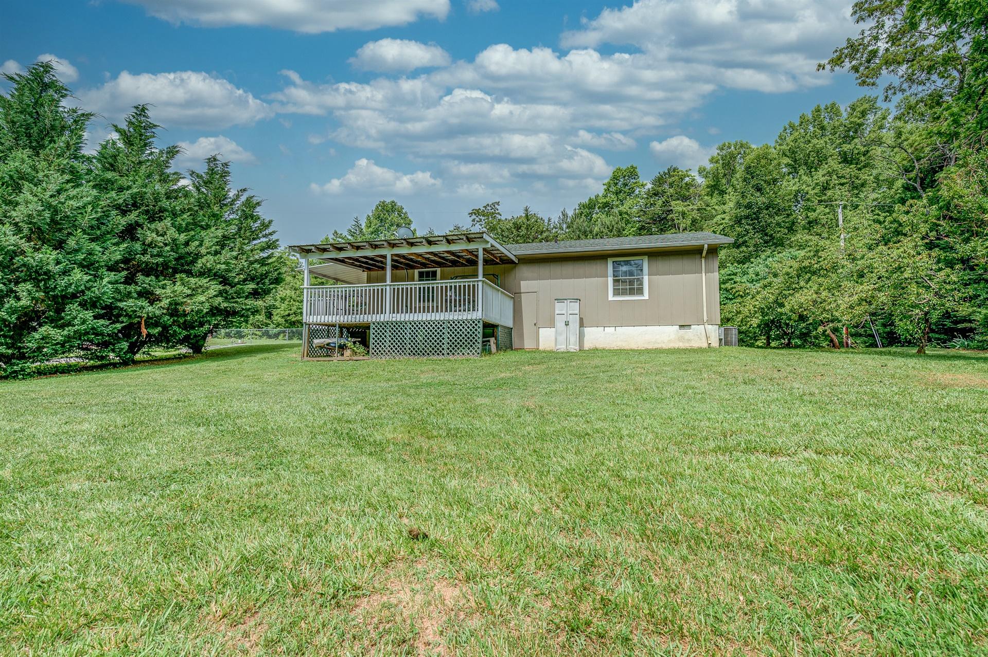 516 Jefferson Dock Road Penhook, VA 24137 - Photo 18 of 20 a view of a house with yard and sitting area
