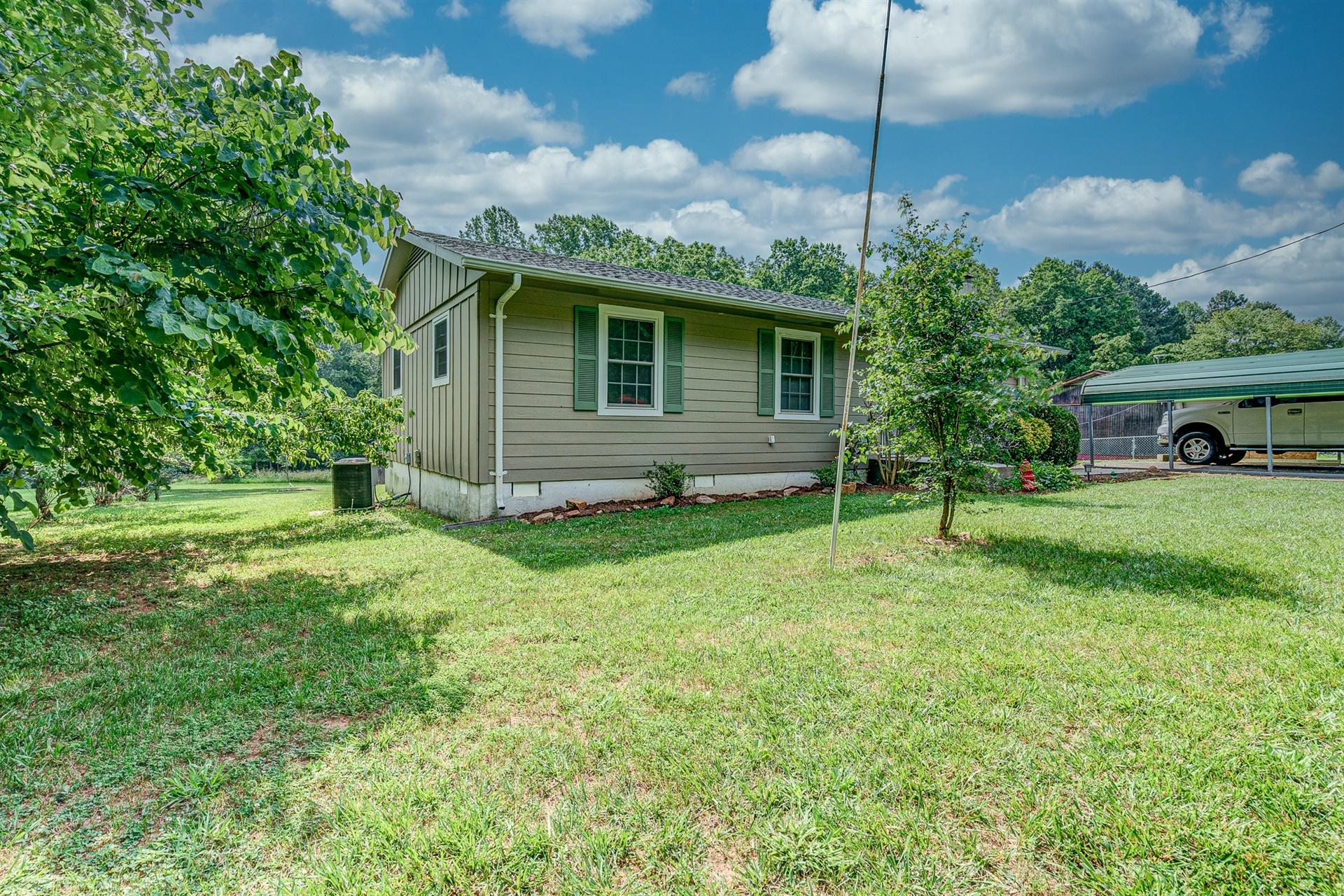 516 Jefferson Dock Road Penhook, VA 24137 - Photo 3 of 20 a front view of a house with garden
