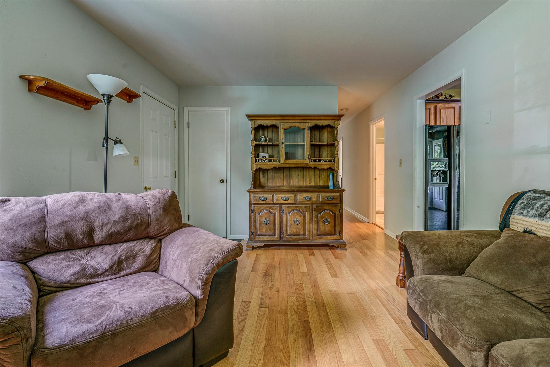 516 Jefferson Dock Road Penhook, VA 24137 - Photo 5 of 20 a living room with furniture and wooden floor