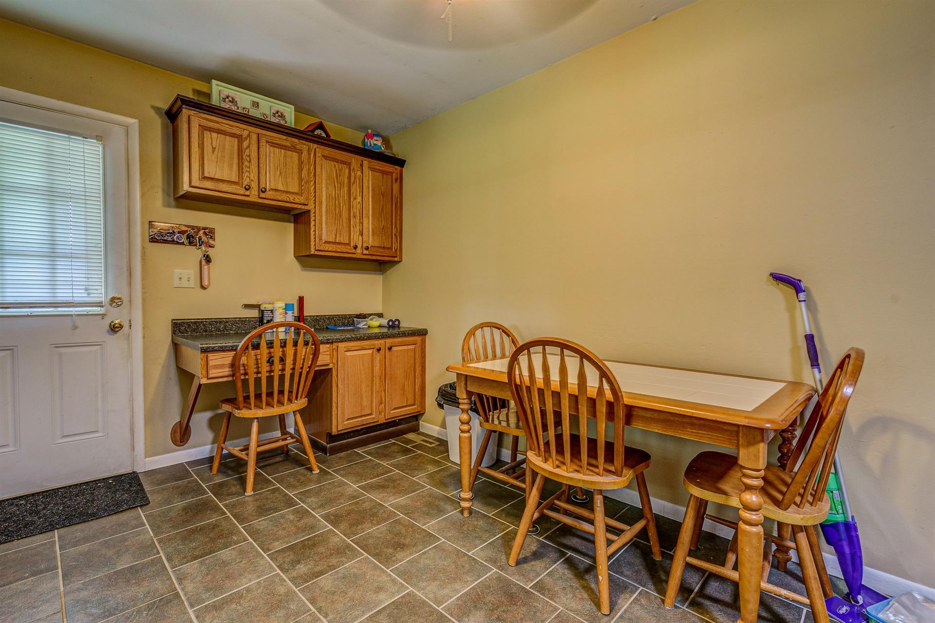 516 Jefferson Dock Road Penhook, VA 24137 - Photo 8 of 20 a view of a chair and table in the patio