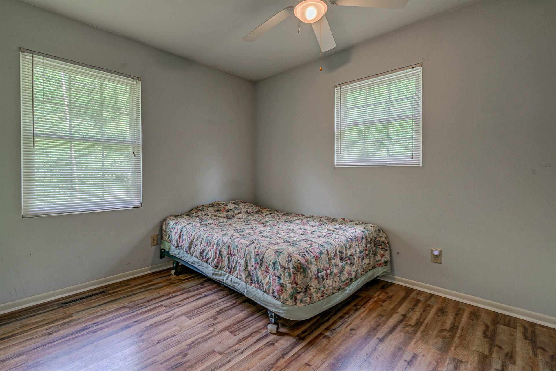516 Jefferson Dock Road Penhook, VA 24137 - Photo 10 of 20 a bedroom with a bed and a window