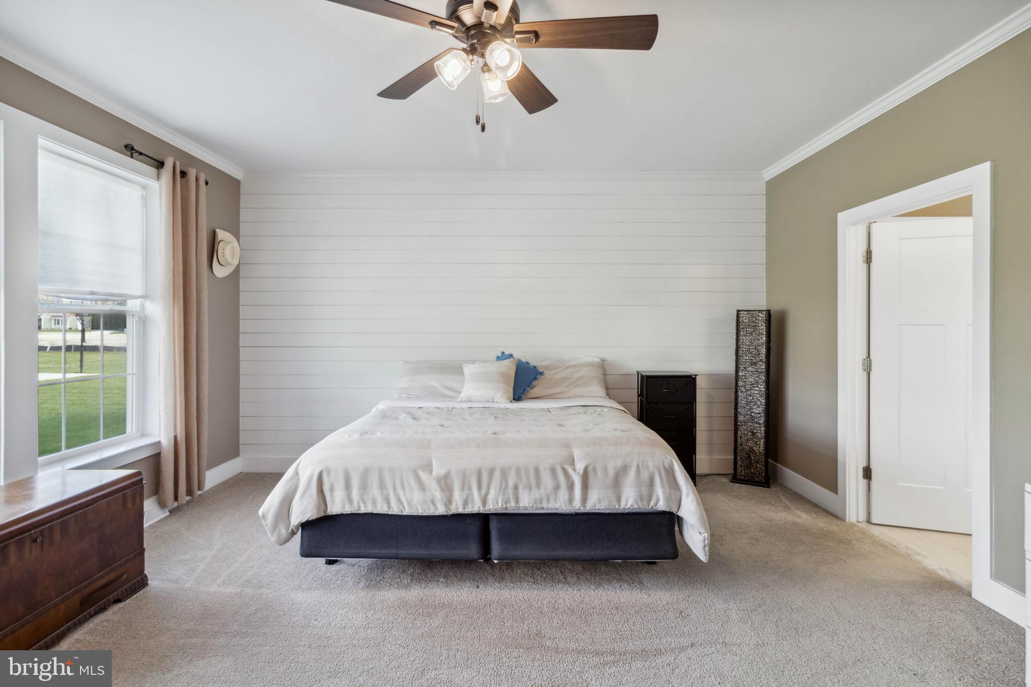24019 Ingrams Drive Millsboro, DE 19966 - Photo 16 of 49 a spacious bedroom with a bed and window