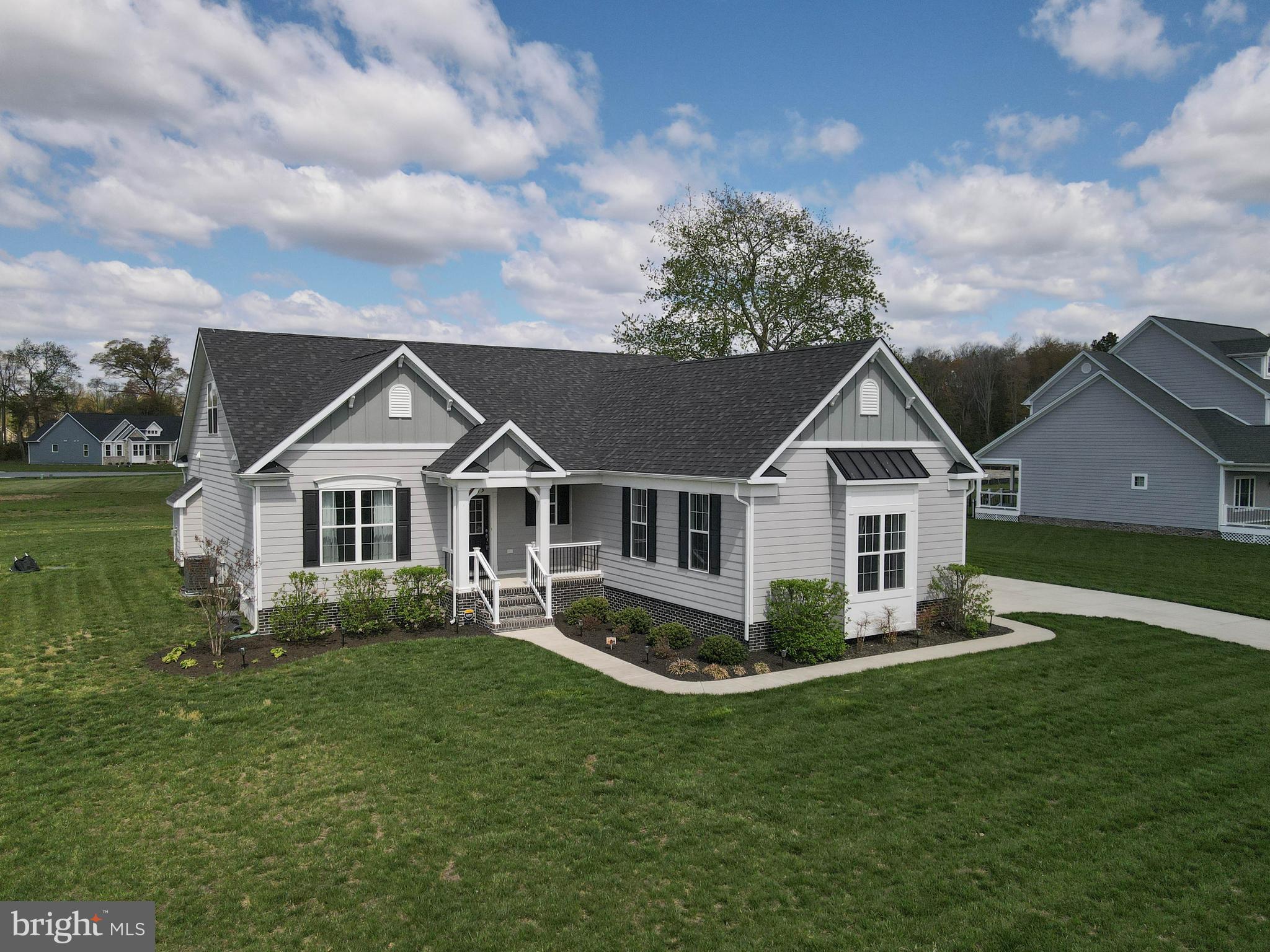 24019 Ingrams Drive Millsboro, DE 19966 - Photo 2 of 49 a front view of a house with a yard
