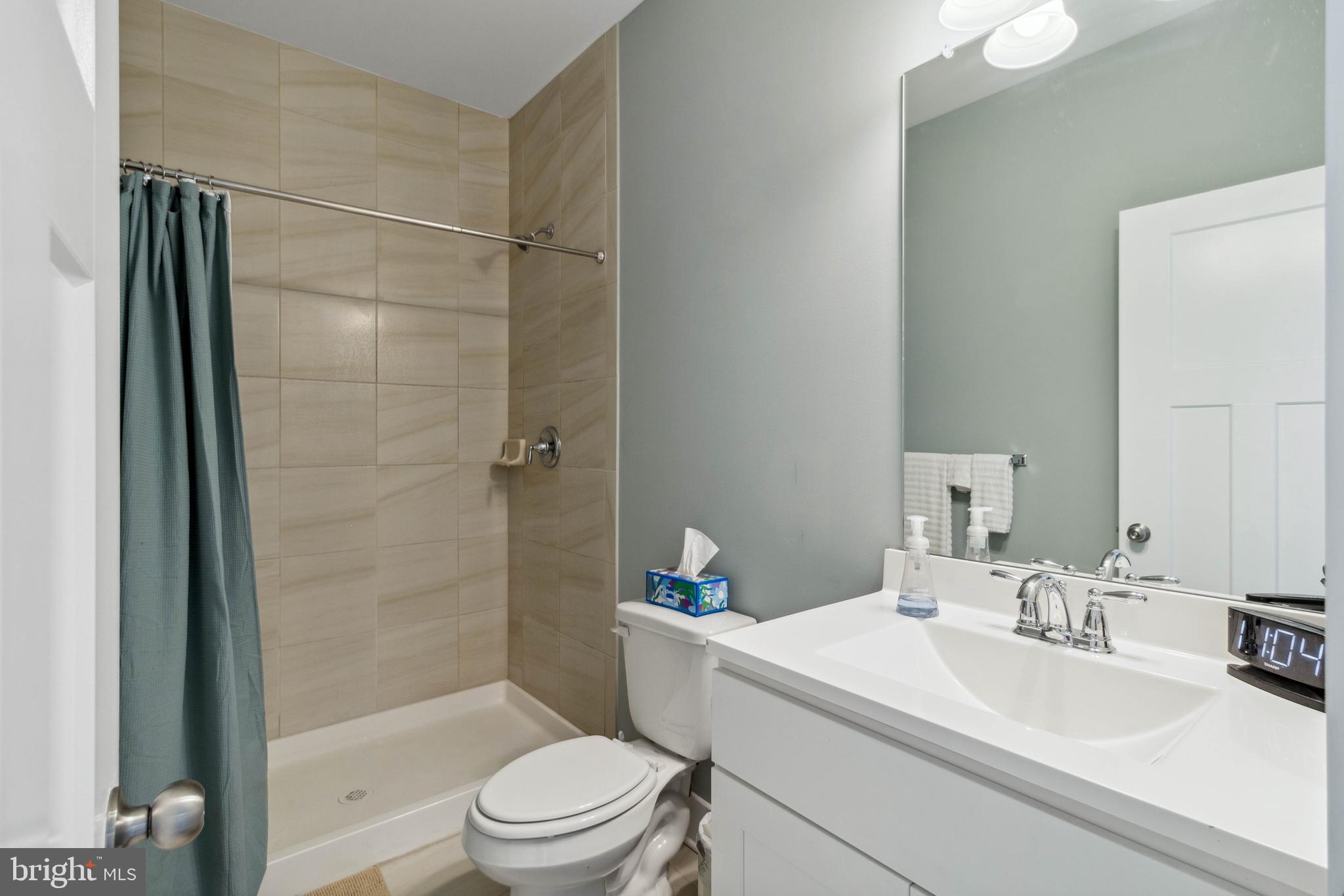 24019 Ingrams Drive Millsboro, DE 19966 - Photo 25 of 49 a bathroom with a sink toilet and shower