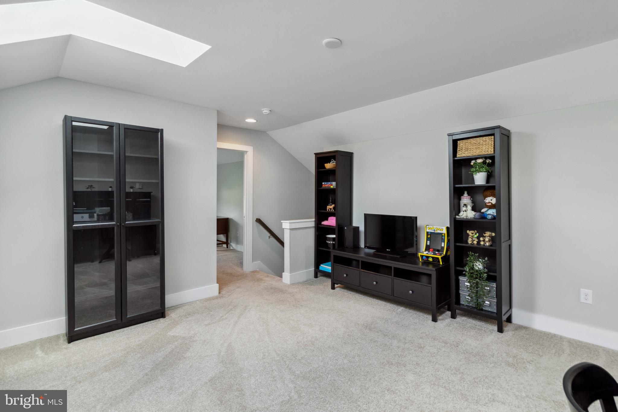 24019 Ingrams Drive Millsboro, DE 19966 - Photo 26 of 49 a living room with furniture and a flat screen tv