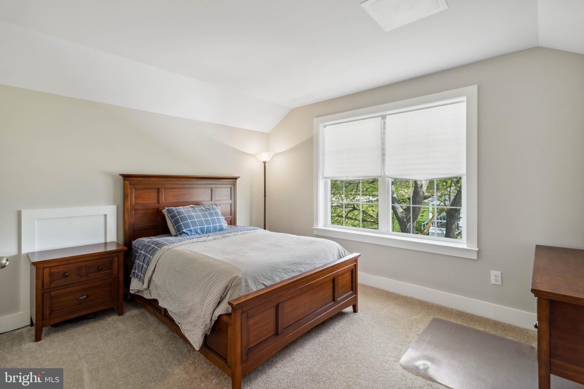 24019 Ingrams Drive Millsboro, DE 19966 - Photo 29 of 49 a bed sitting in a bedroom next to a window