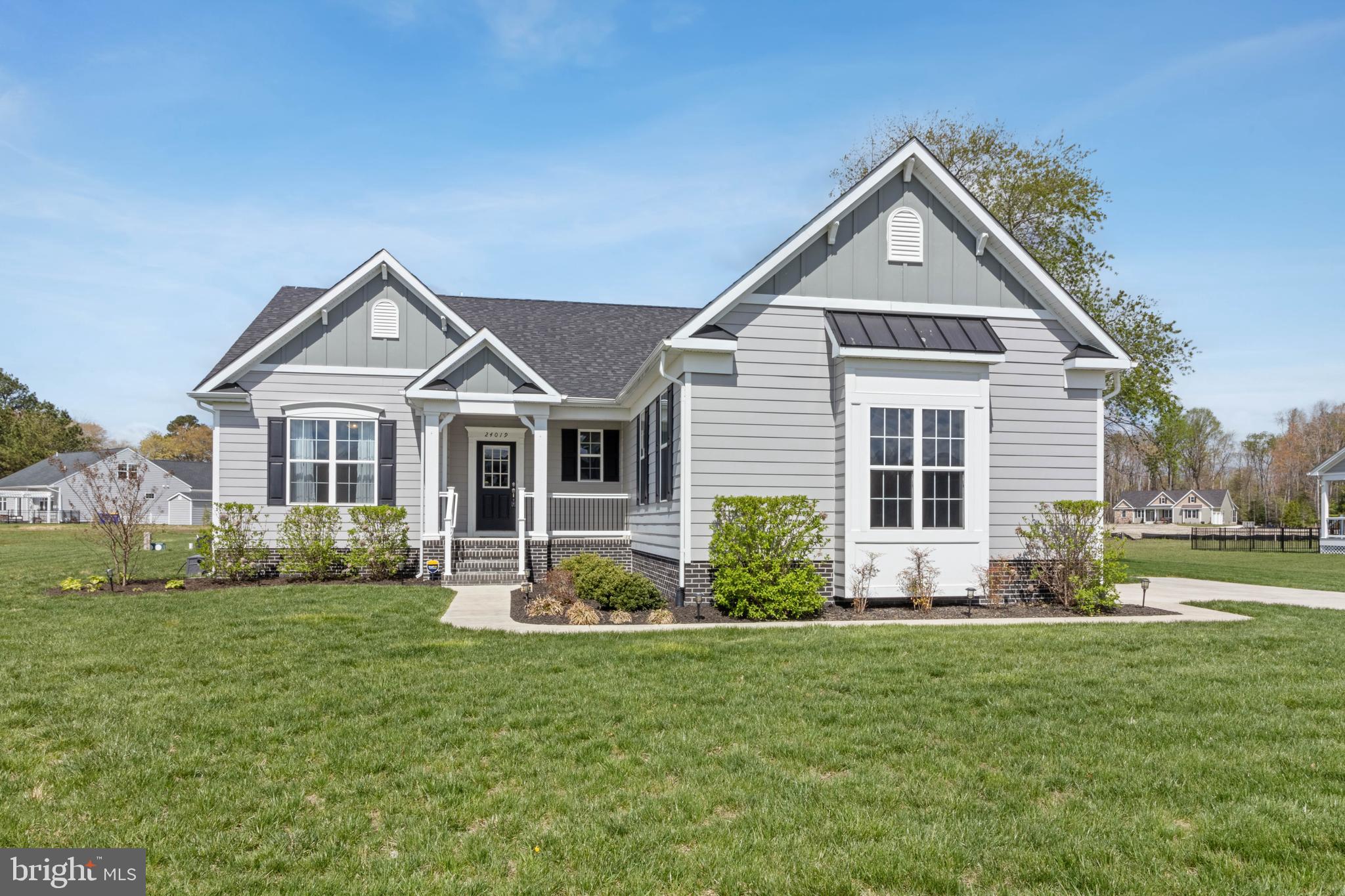 24019 Ingrams Drive Millsboro, DE 19966 - Photo 41 of 49 a front view of a house with a yard