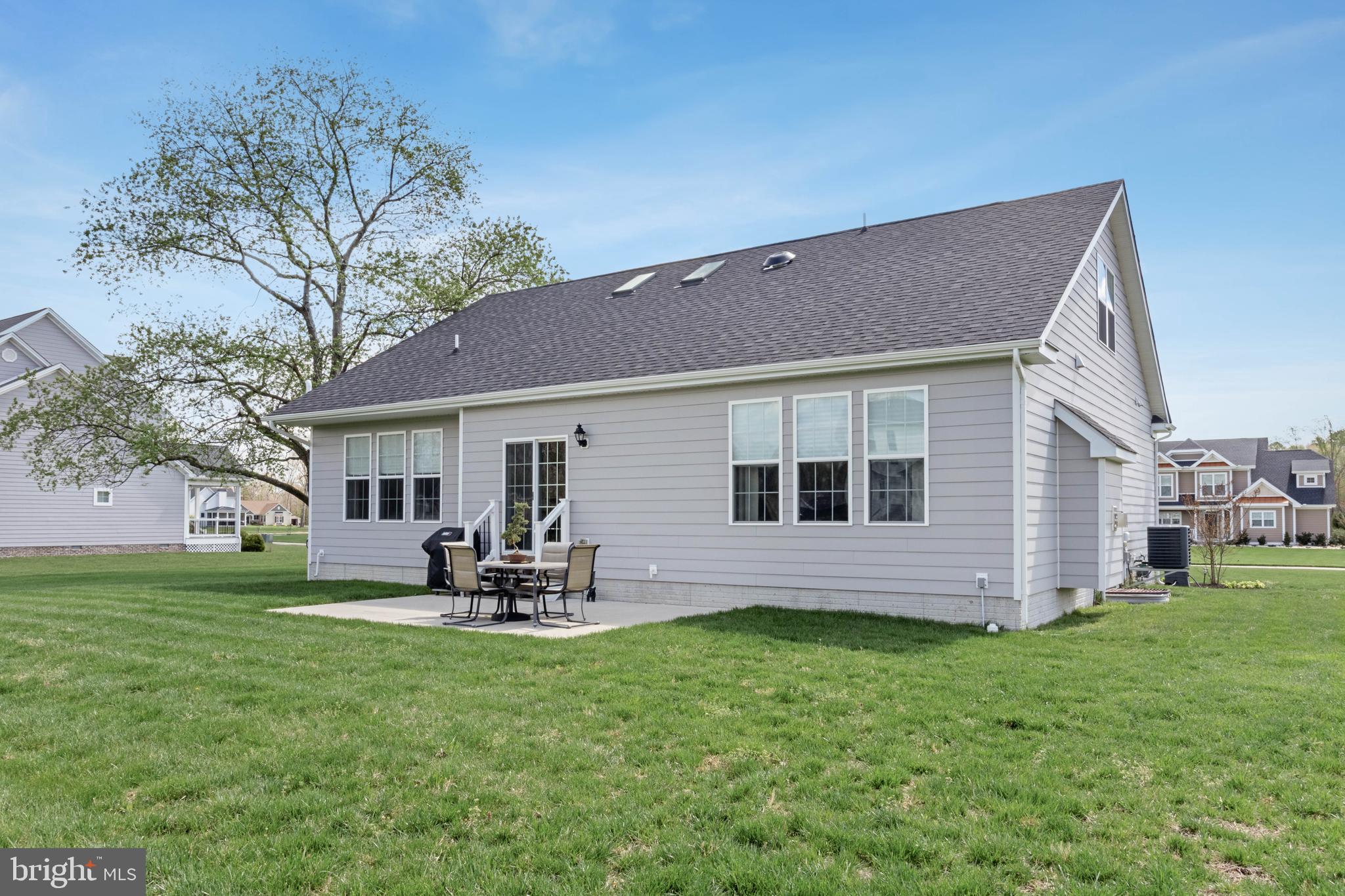 24019 Ingrams Drive Millsboro, DE 19966 - Photo 43 of 49 a front view of house with yard and outdoor seating