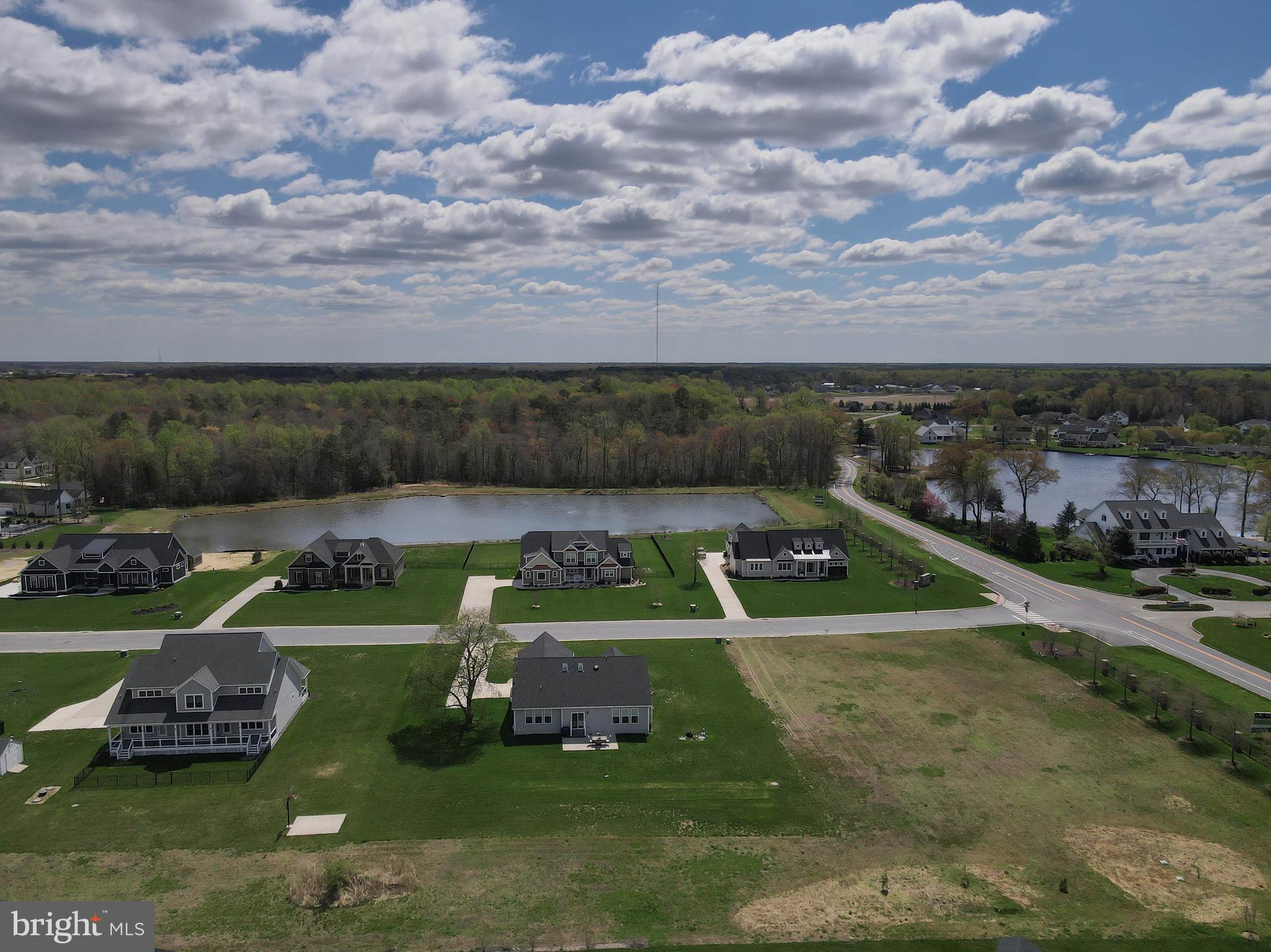 24019 Ingrams Drive Millsboro, DE 19966 - Photo 45 of 49 a view of a lake with houses