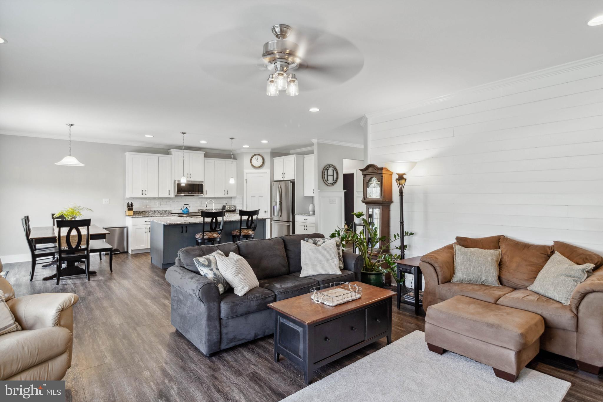 24019 Ingrams Drive Millsboro, DE 19966 - Photo 10 of 49 a living room with furniture kitchen view and a chandelier
