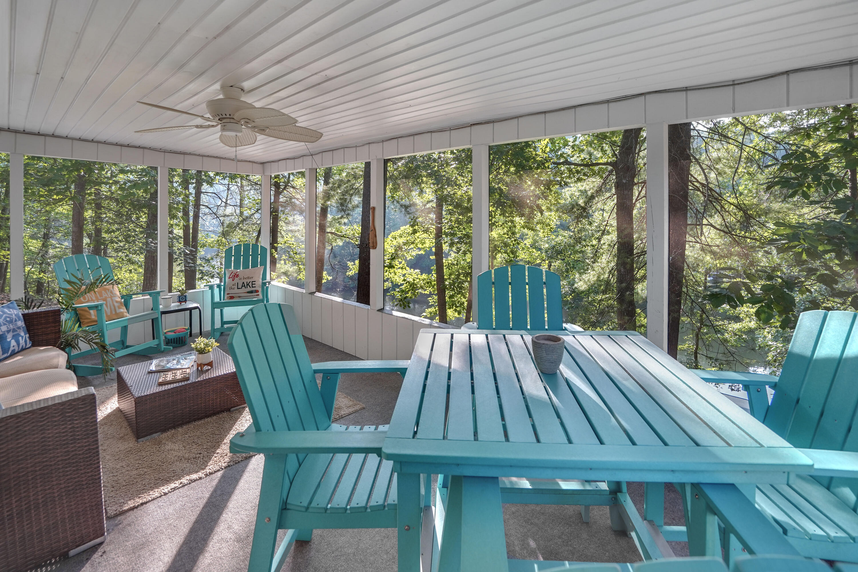 518 Ridgelake Road Goodview, VA 24095 - Photo 16 of 27 a view of patio with table and chairs and couches with wooden floor and fence