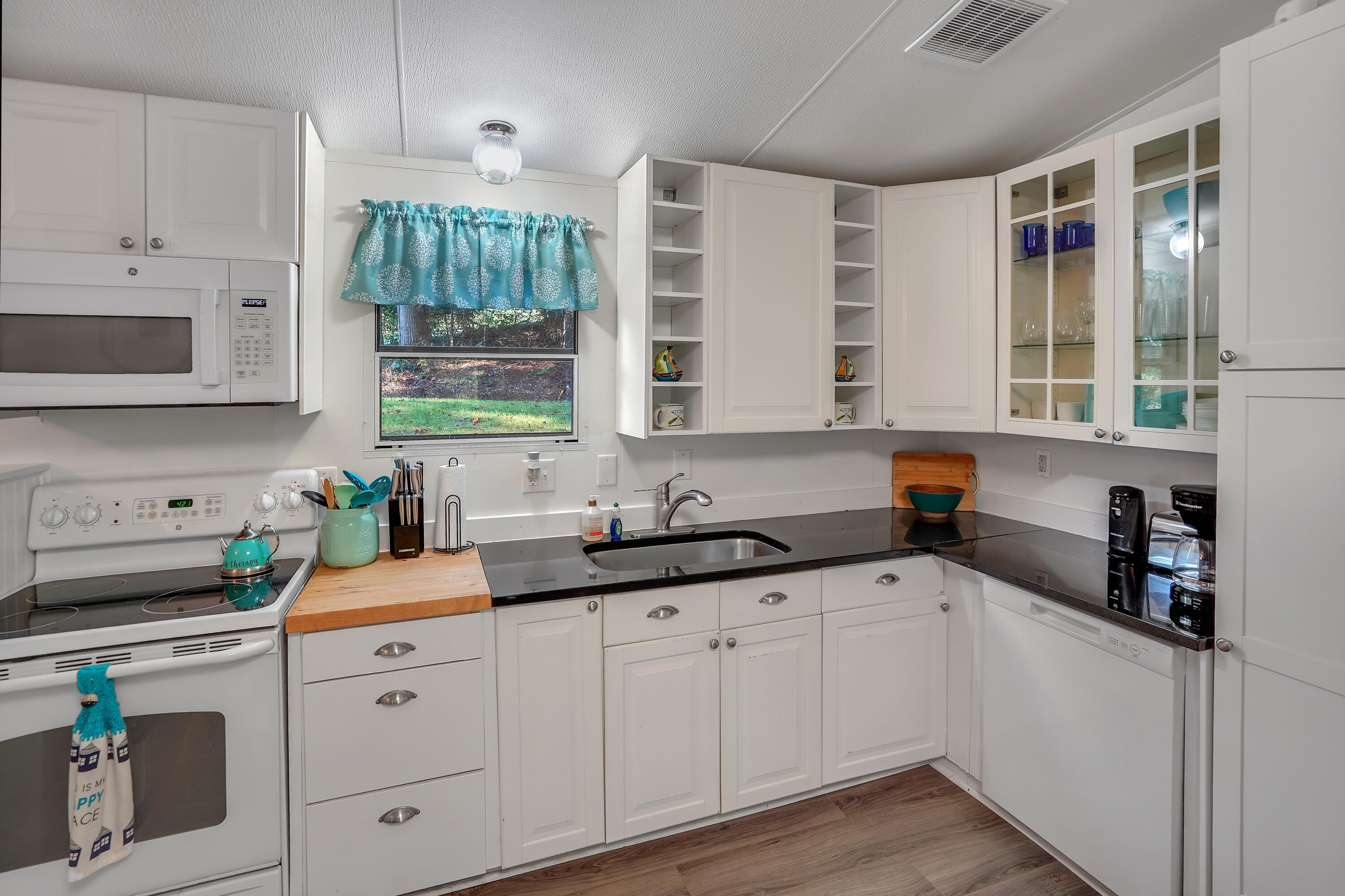 518 Ridgelake Road Goodview, VA 24095 - Photo 6 of 27 a kitchen with cabinets appliances a sink and a window