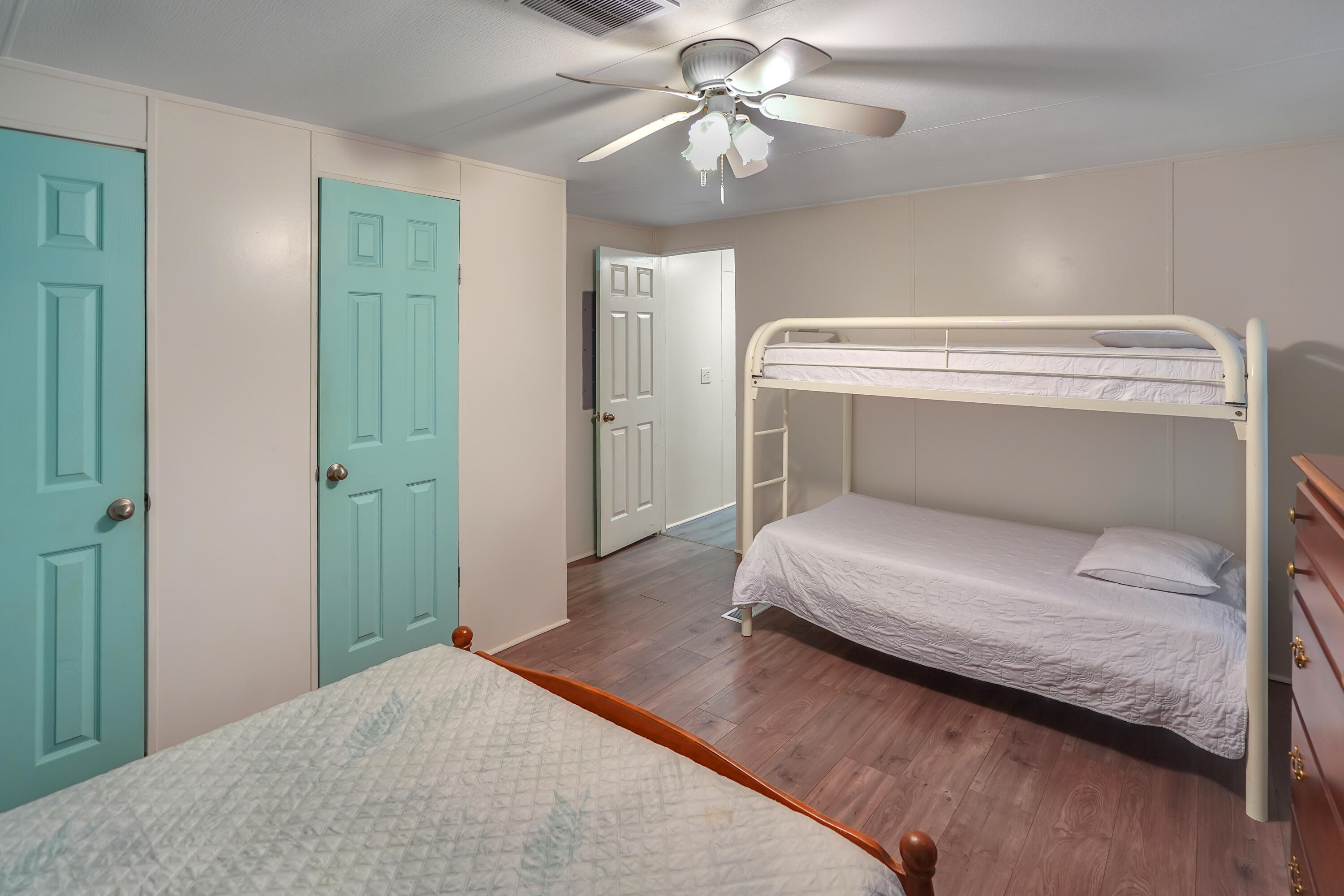 518 Ridgelake Road Goodview, VA 24095 - Photo 9 of 27 a bedroom with a bed and a chandelier