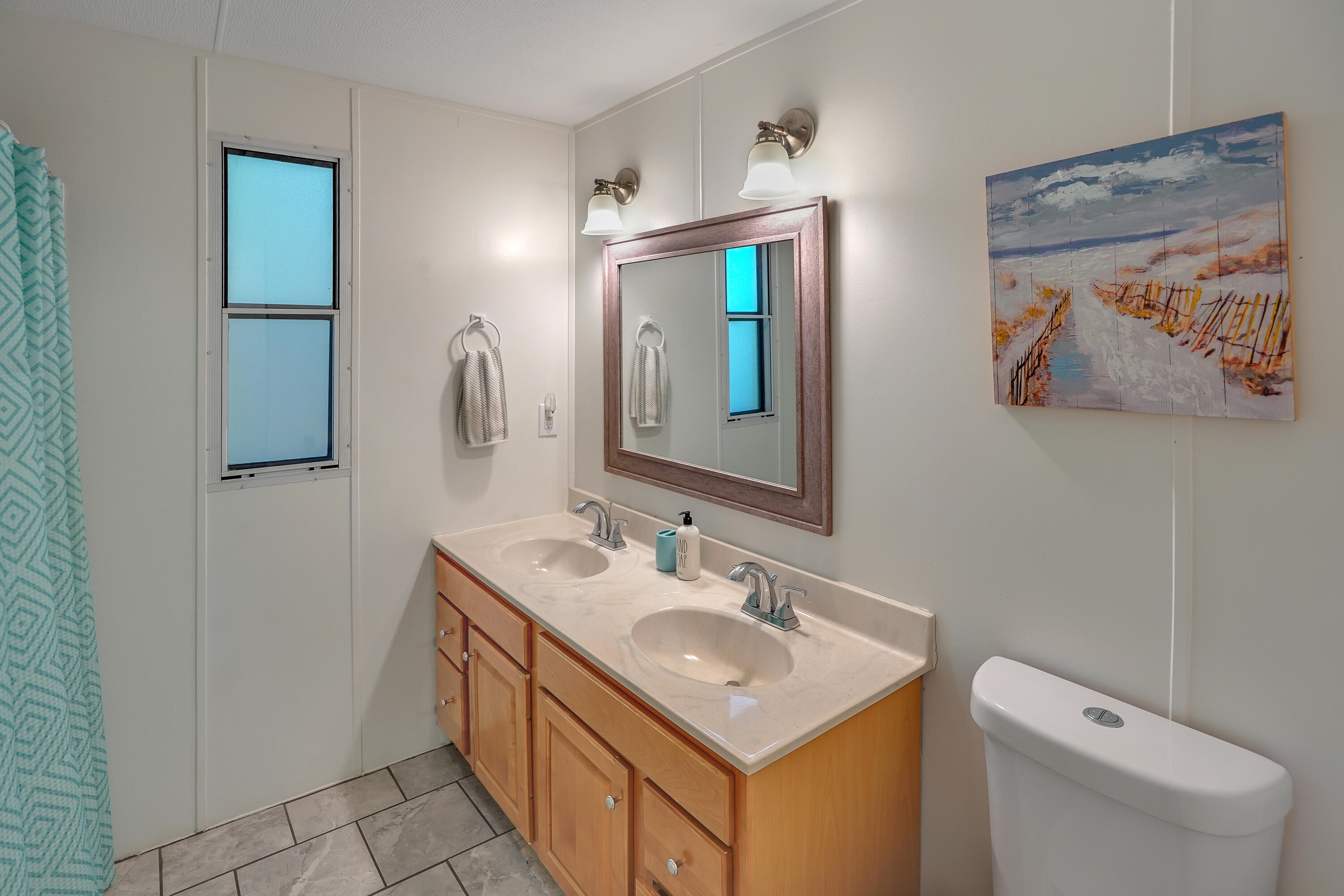 518 Ridgelake Road Goodview, VA 24095 - Photo 10 of 27 a bathroom with a toilet sink and mirror