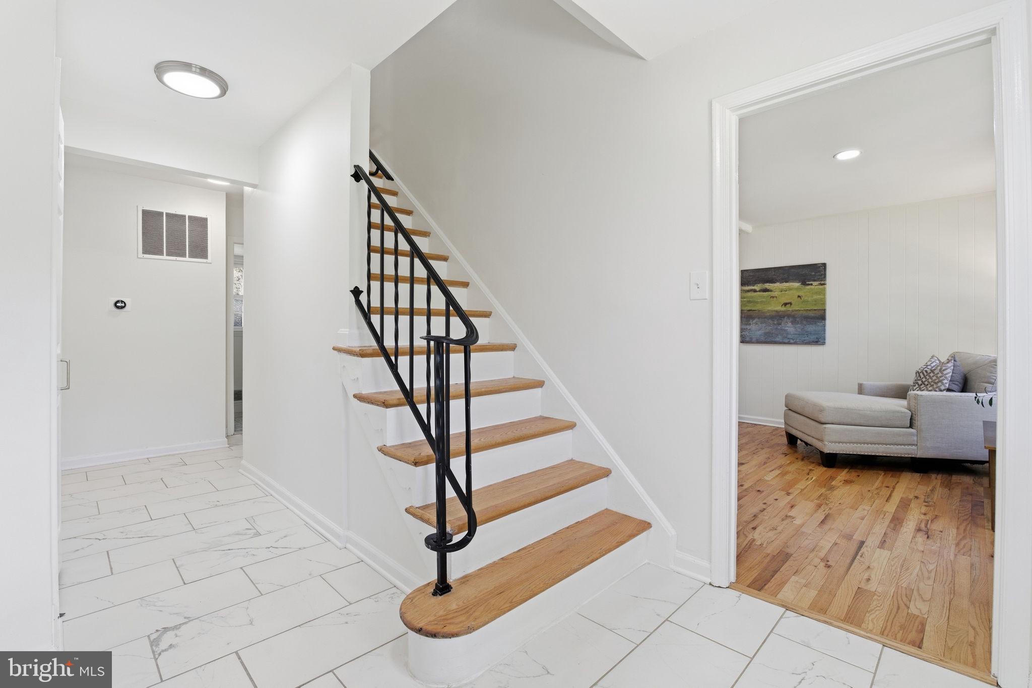 15101 Redgate Drive Silver Spring, MD 20905 - Photo 7 of 39 a view of entryway and hall with wooden floor