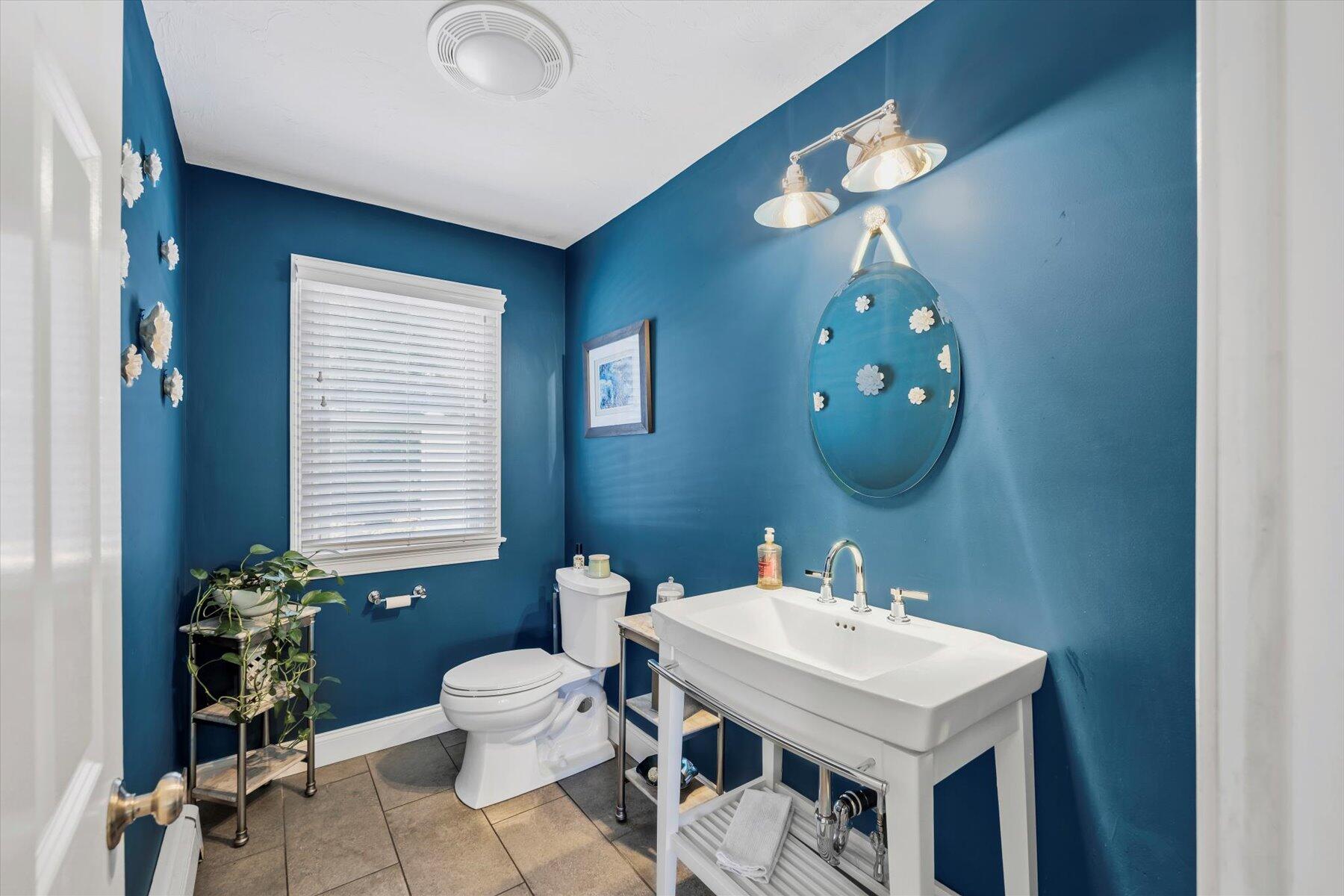 1 Ravens Nest Road Sandwich, MA 02563 - Photo 11 of 46 a bathroom with a sink a light fixture and a mirror
