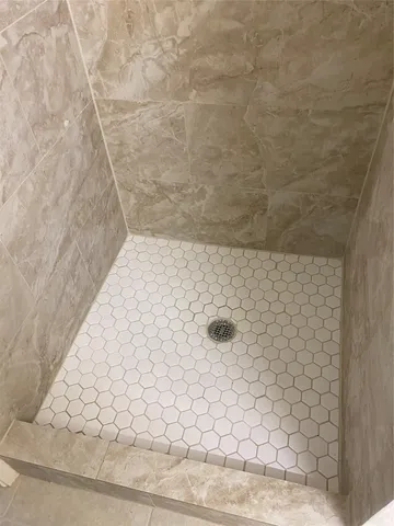 a white toilet sitting next to a sink