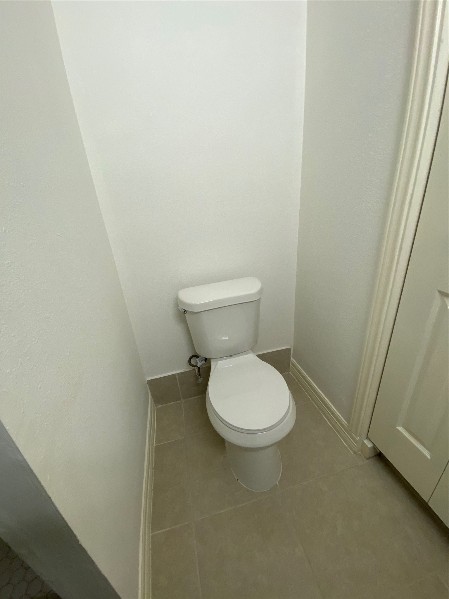 3826 Botany Lane Houston, TX 77047 - Photo 35 of 37 a white toilet sitting next to a sink