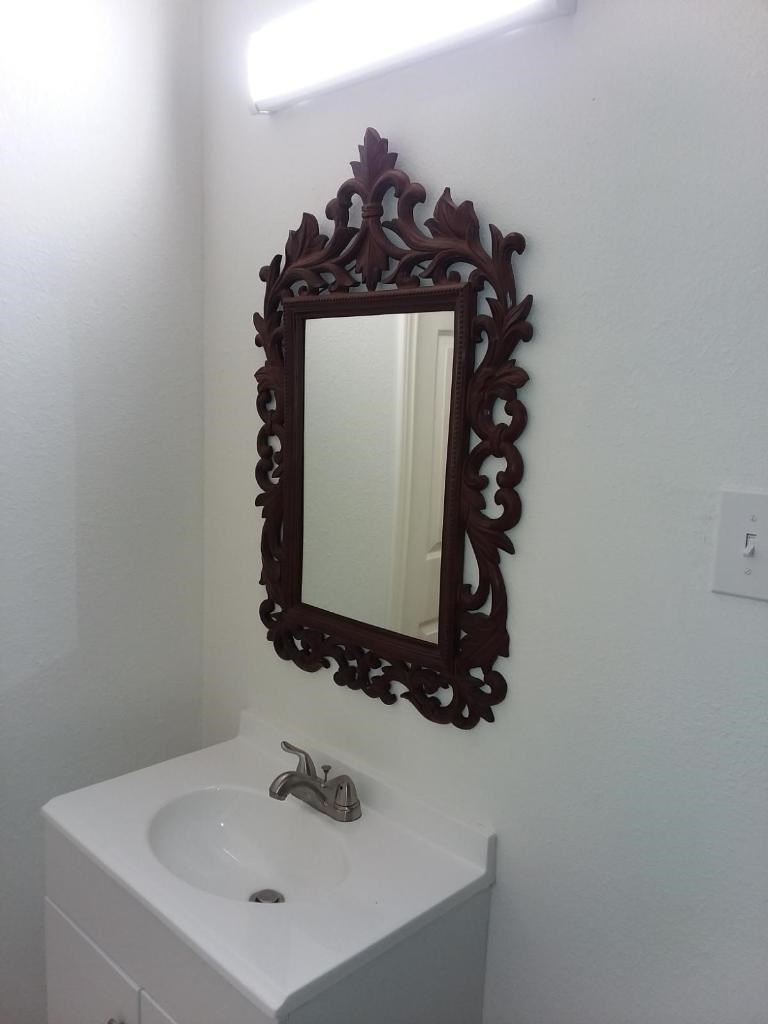 3826 Botany Lane Houston, TX 77047 - Photo 37 of 37 a bathroom with a sink and a mirror