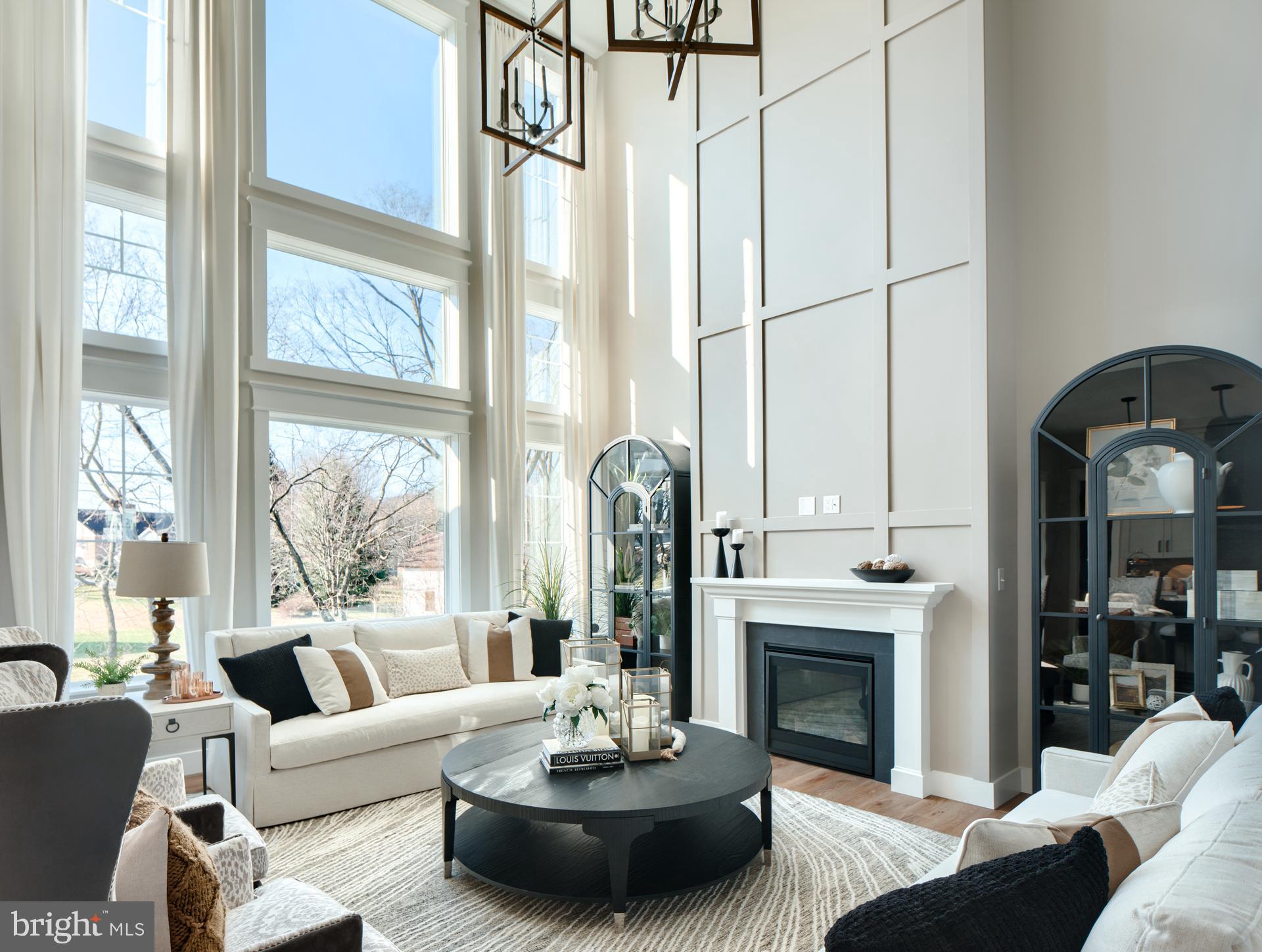 707007728 Hook Road, Unit MAGNOLIA Westminster, MD 21157 - Photo 7 of 20 a living room with furniture a fireplace and a large window with garden view