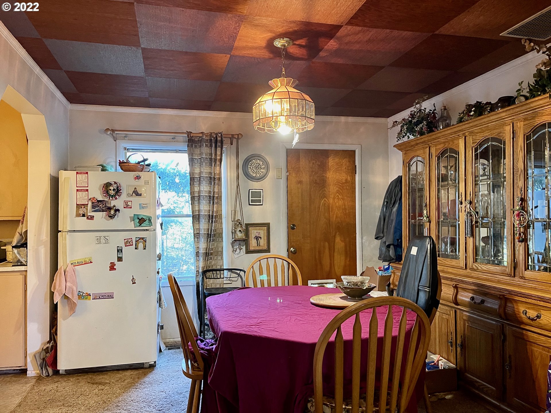810 54th Street Springfield, OR 97478 - Photo 6 of 25 a view of a dining room with furniture and chandelier