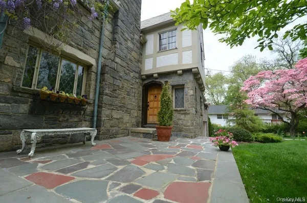 a front view of a house with garden
