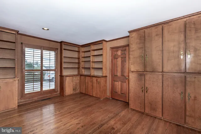 a living room with furniture a table and a potted plant