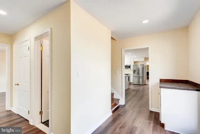 a house view with swimming pool in front of it