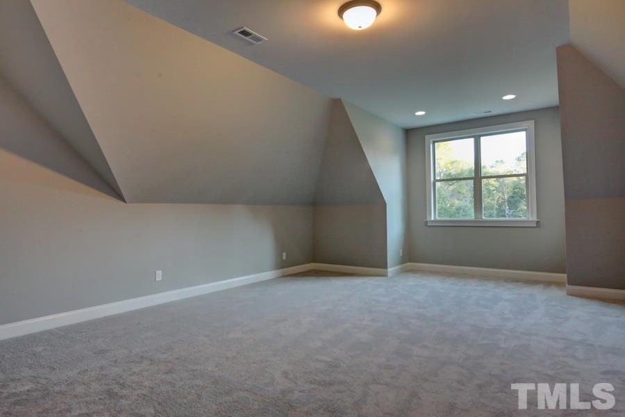 6909 Old Mills Road Fuquay-Varina, NC 27526 - Photo 19 of 25 an empty room with windows