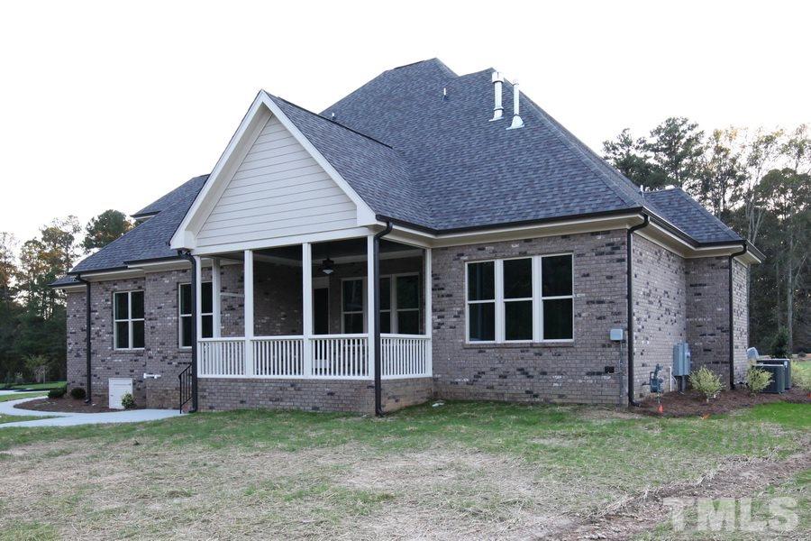 6909 Old Mills Road Fuquay-Varina, NC 27526 - Photo 22 of 25 a view of front of a house with a yard