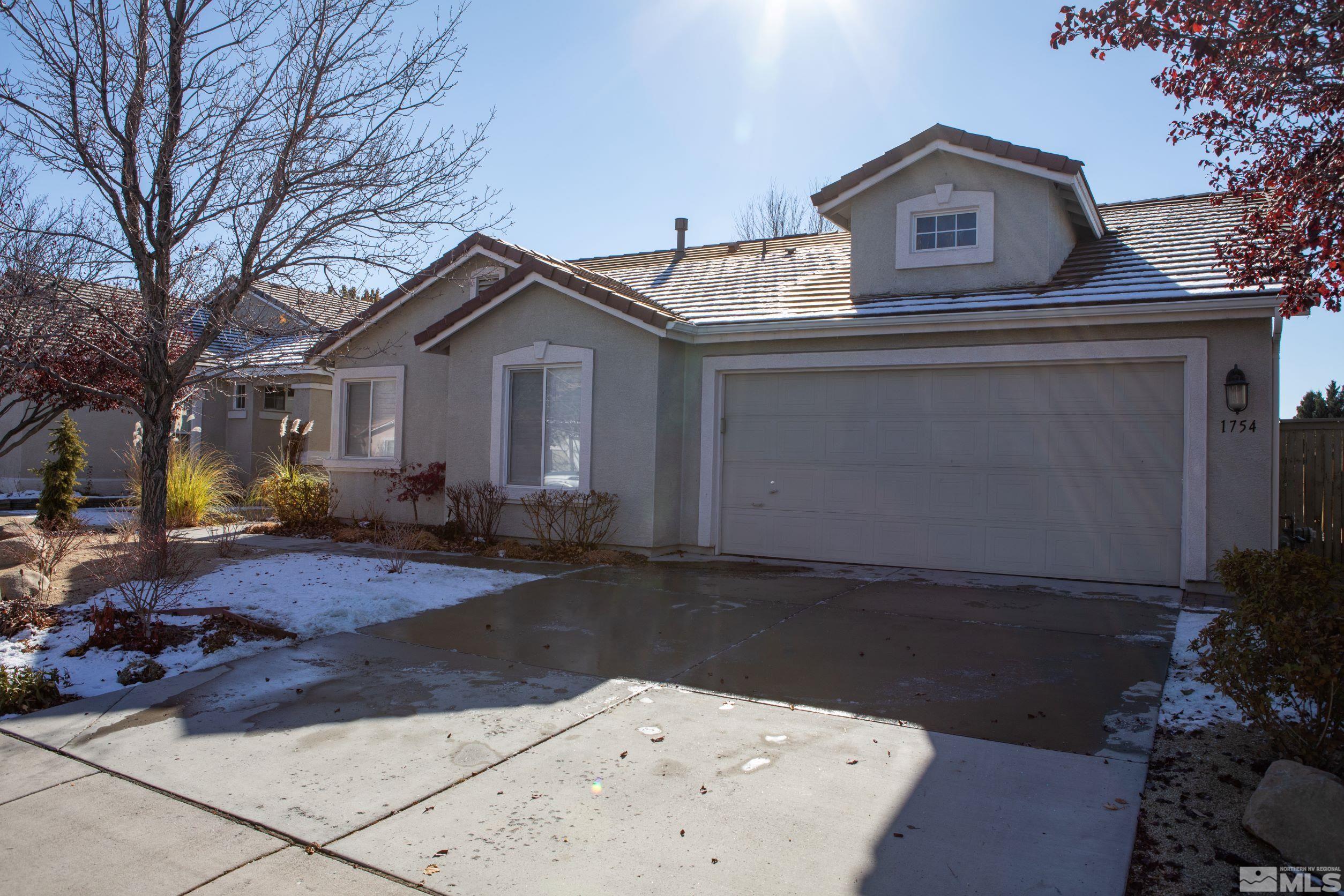 1754 River Gorge Drive Reno, NV 89521 - Photo 1 of 18 a front view of a house with garden