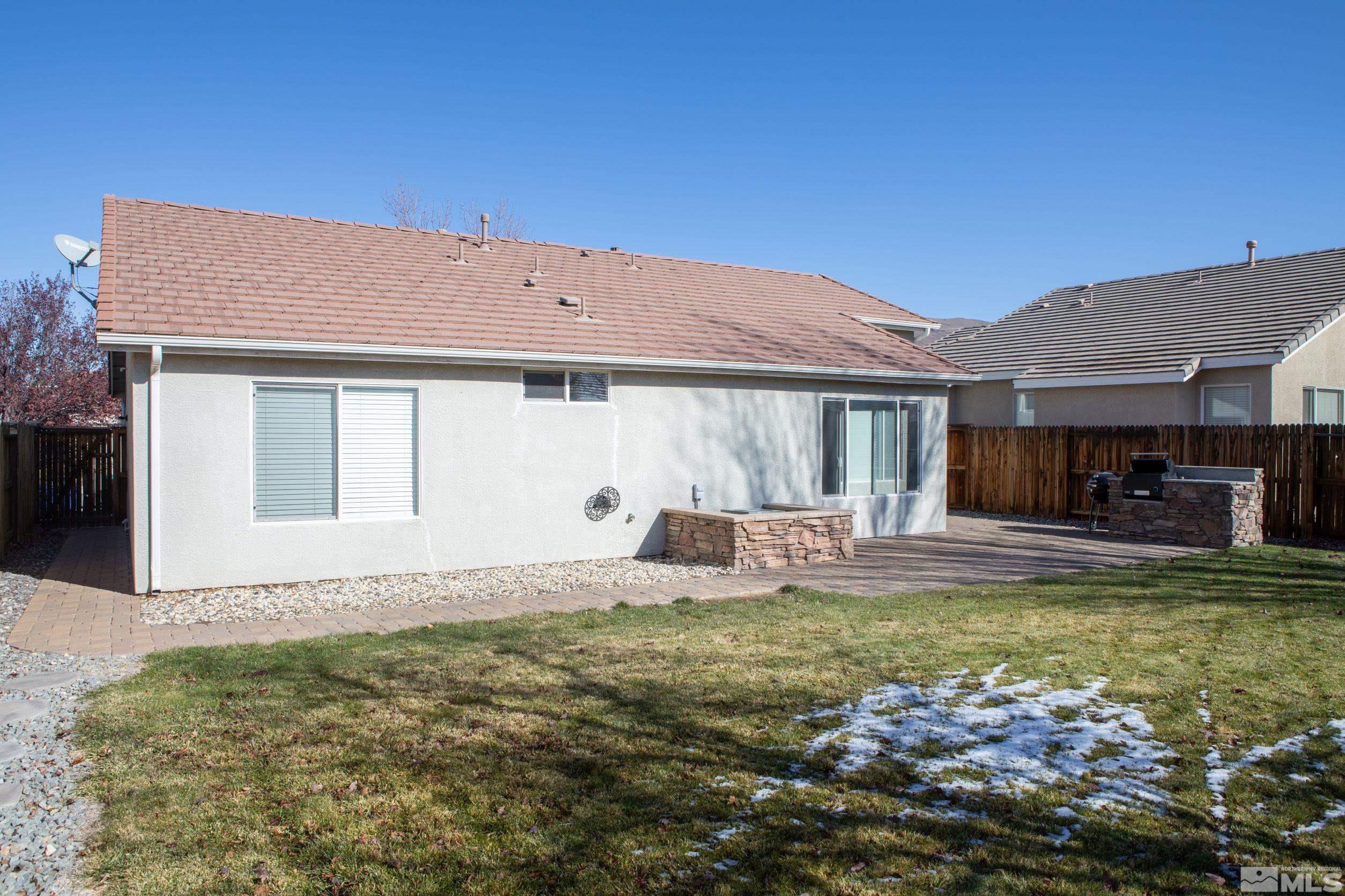 1754 River Gorge Drive Reno, NV 89521 - Photo 17 of 18 a view of a house with swimming pool and a yard
