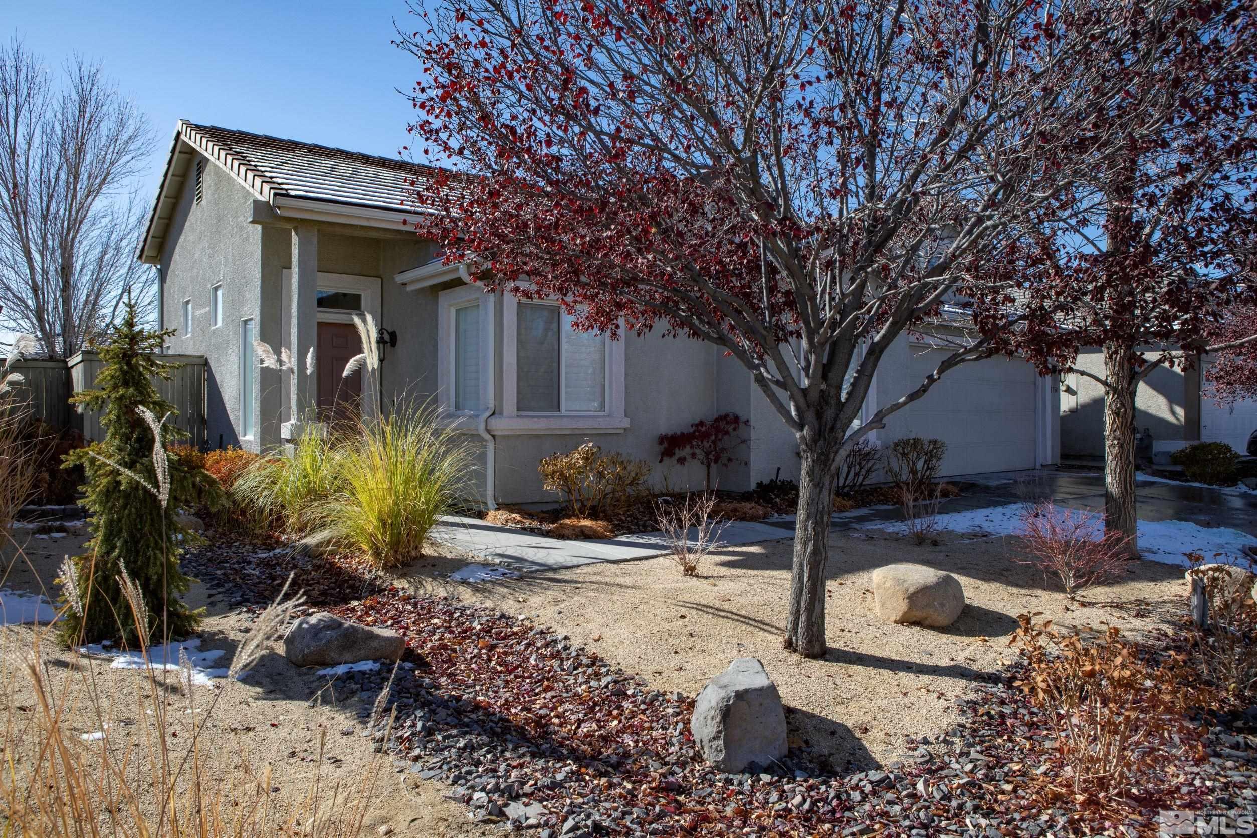 1754 River Gorge Drive Reno, NV 89521 - Photo 2 of 18 a front view of a house with garden