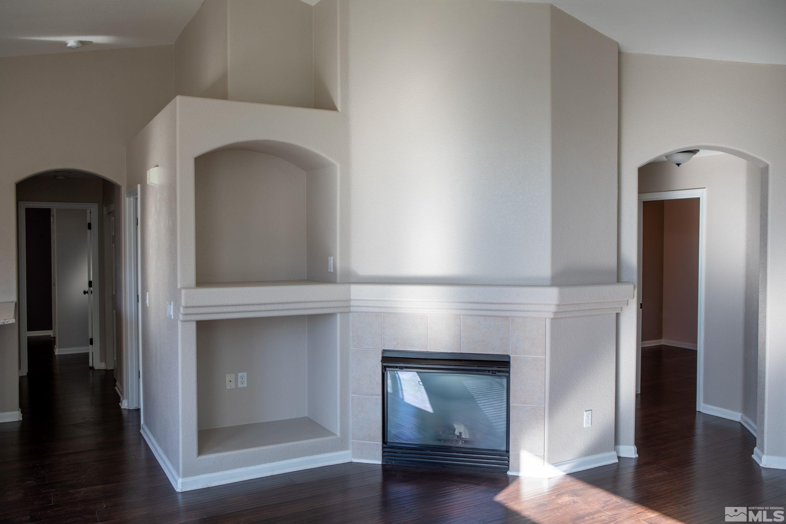 1754 River Gorge Drive Reno, NV 89521 - Photo 5 of 18 a hallway with fireplace and wooden floor