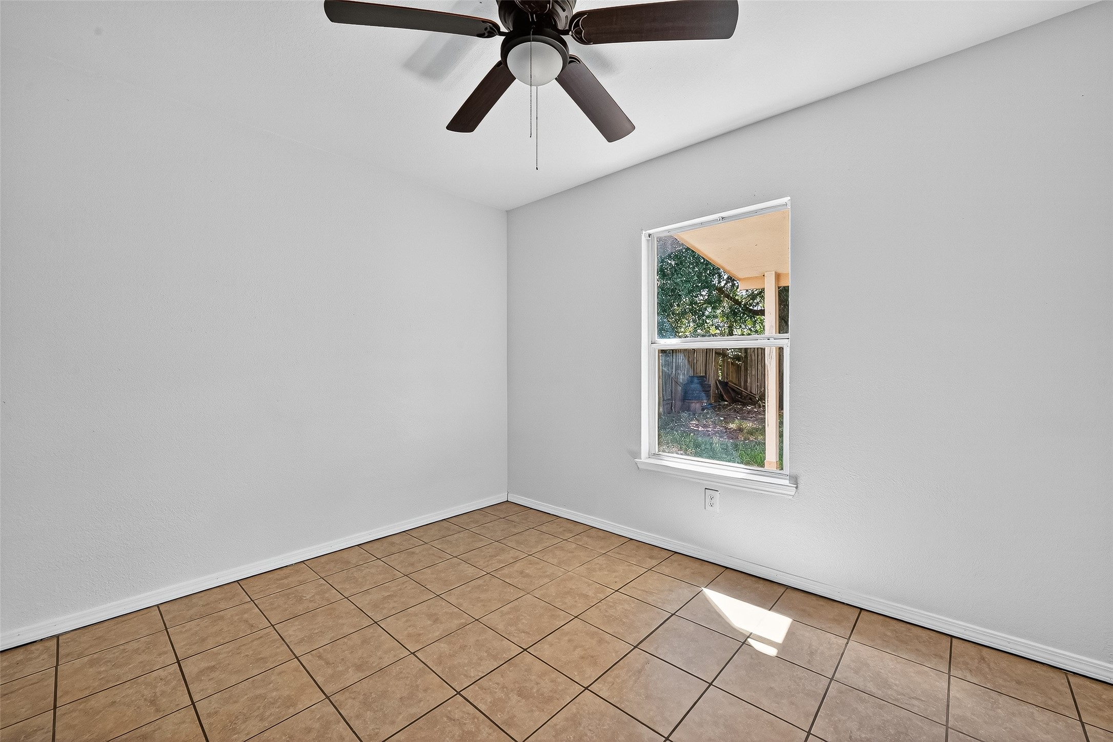22819 Cabanna Road Spring, TX 77389 - Photo 16 of 26 a view of an empty room and window