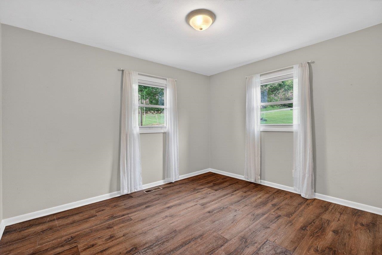 3259 Zion Church Road Broadway, VA 22815 - Photo 21 of 48 an empty room with wooden floor and windows